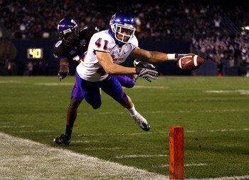 SAN DIEGO, CA - DECEMBER 23:  Runningback Ian Johnson #41 of the Boise State Broncos dives for the endzone pilon against the defense of Cornerback Rafael Priest #10 of TCU during the San Diego County Credit Union Poinsettia Bowl at Qualcomm Stadium on Dec