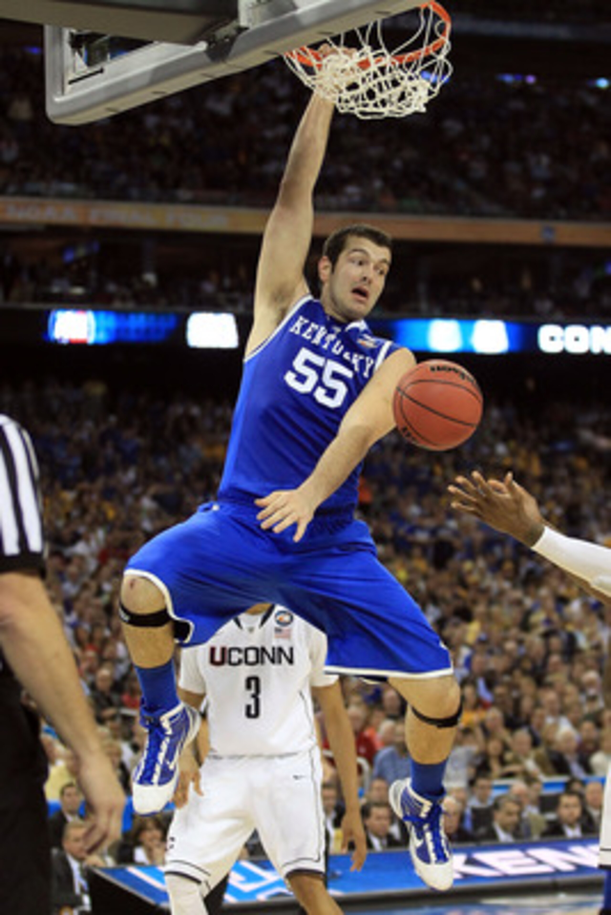 HOUSTON, TX - APRIL 02:  Josh Harrellson #55 of the Kentucky Wildcats dunks the ball against the Connecticut Huskies during the National Semifinal game of the 2011 NCAA Division I Men's Basketball Championship at Reliant Stadium on April 2, 2011 in Housto