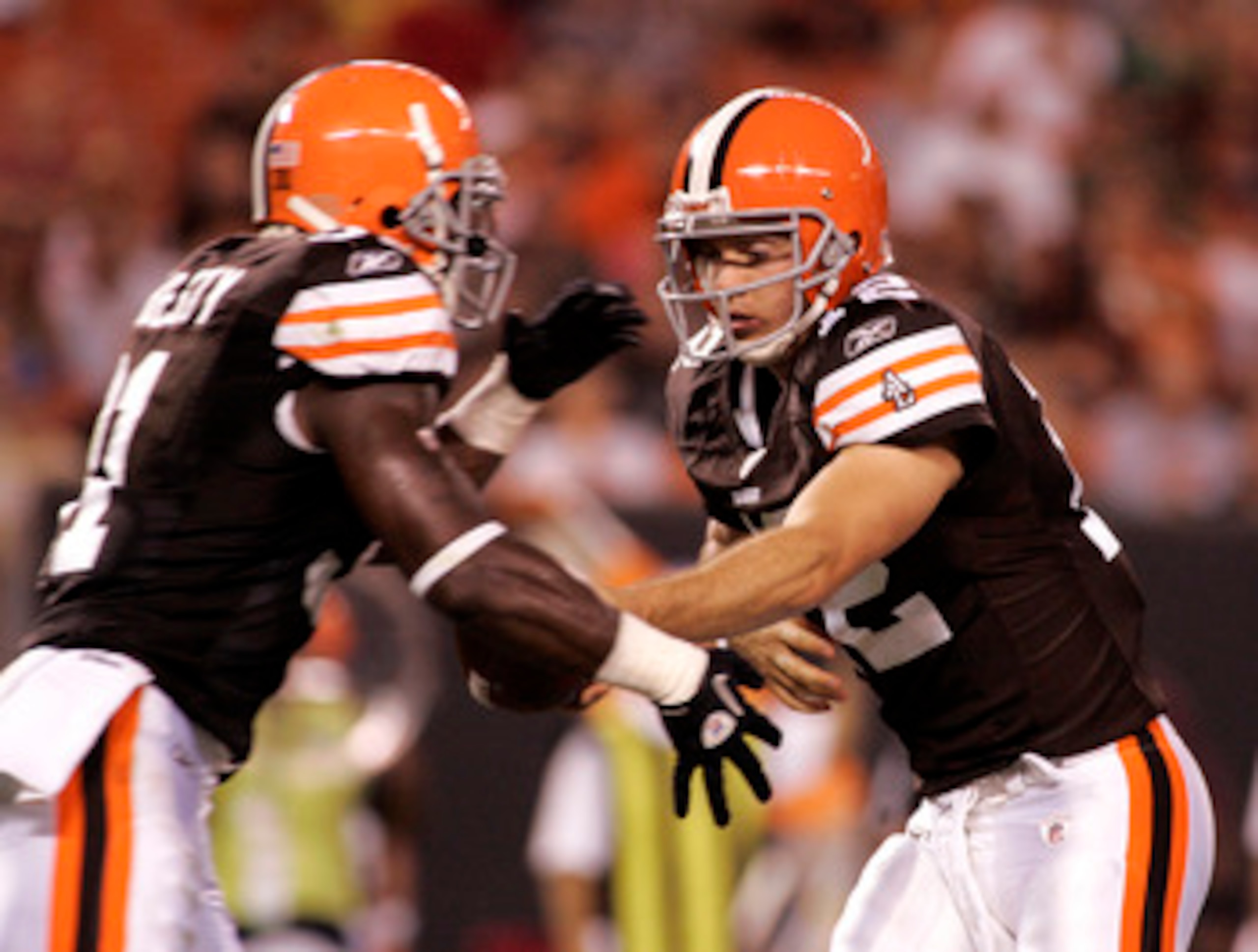 CLEVELAND - SEPTEMBER 2:  Colt McCoy #12 of the Cleveland Browns hands the ball off to Montario Hardesty #31 against the Chicago Bears during the preseason game on September 2, 2010 at Cleveland Browns Stadium in Cleveland, Ohio. The Browns defeated the B