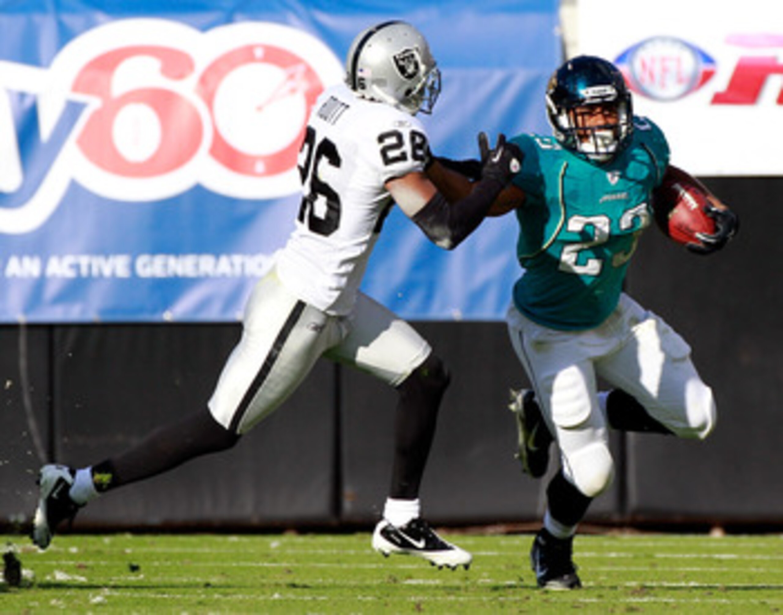 JACKSONVILLE, FL - DECEMBER 12:  Rashad Jennings #23 of the Jacksonville Jaguars rushes against Stanford Routt #26 of the Oakland Raiders during the game at EverBank Field on December 12, 2010 in Jacksonville, Florida.  (Photo by Sam Greenwood/Getty Image