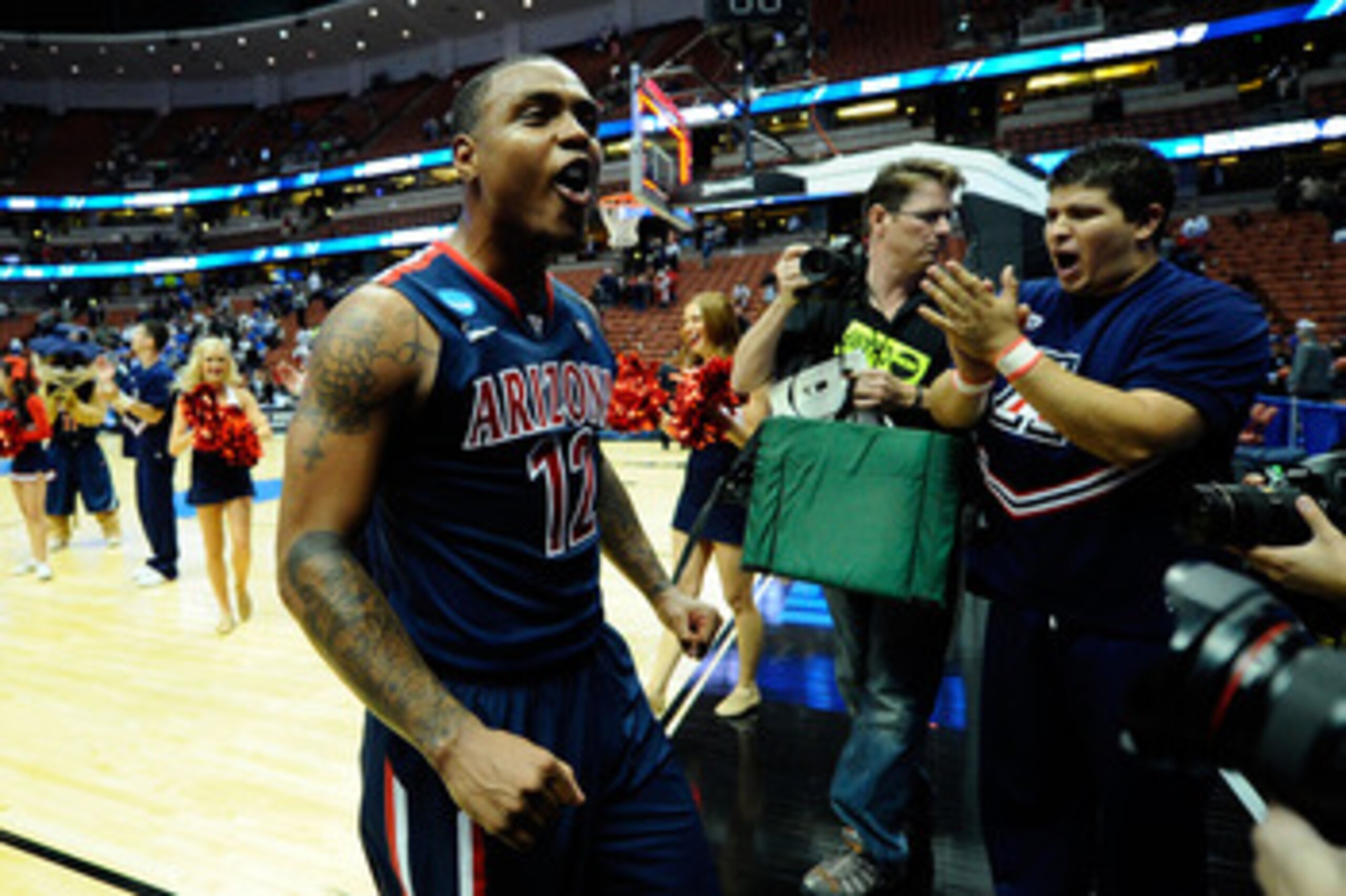 ANAHEIM, CA - MARCH 24:  Lamont Jones #12 of the Arizona Wildcats celebrates after defeating the Duke Blue Devils during the west regional semifinal of the 2011 NCAA men's basketball tournament at the Honda Center on March 24, 2011 in Anaheim, California.