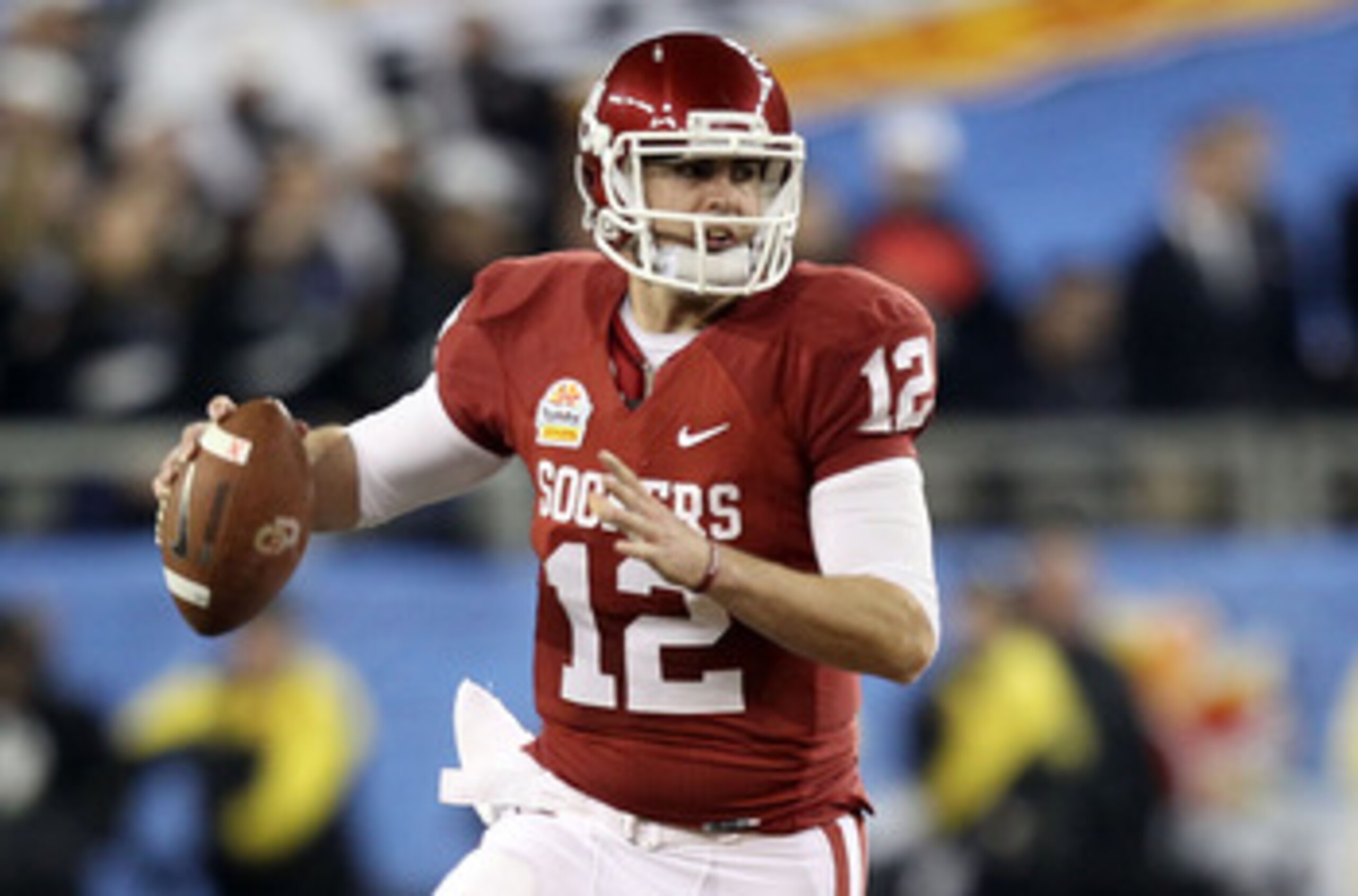 GLENDALE, AZ - JANUARY 01:  Landry Jones #12 of the Oklahoma Sooners throws the ball against the Connecticut Huskies during the Tostitos Fiesta Bowl at the Universtity of Phoenix Stadium on January 1, 2011 in Glendale, Arizona.  (Photo by Christian Peters