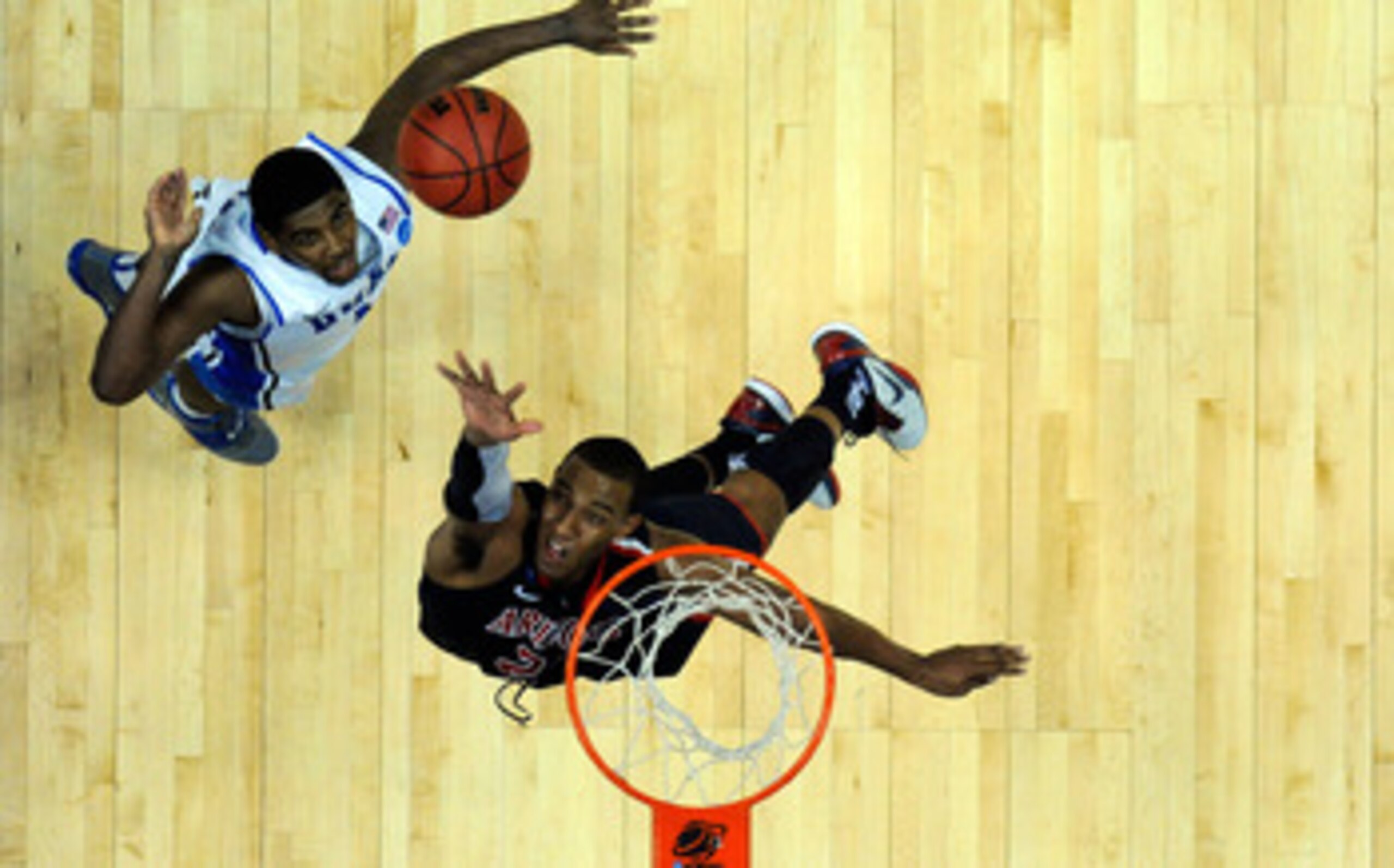 ANAHEIM, CA - MARCH 24:  Derrick Williams #23 of the Arizona Wildcats goes up for the ball against Kyrie Irving #1 of the Duke Blue Devils during the west regional semifinal of the 2011 NCAA men's basketball tournament at the Honda Center on March 24, 201