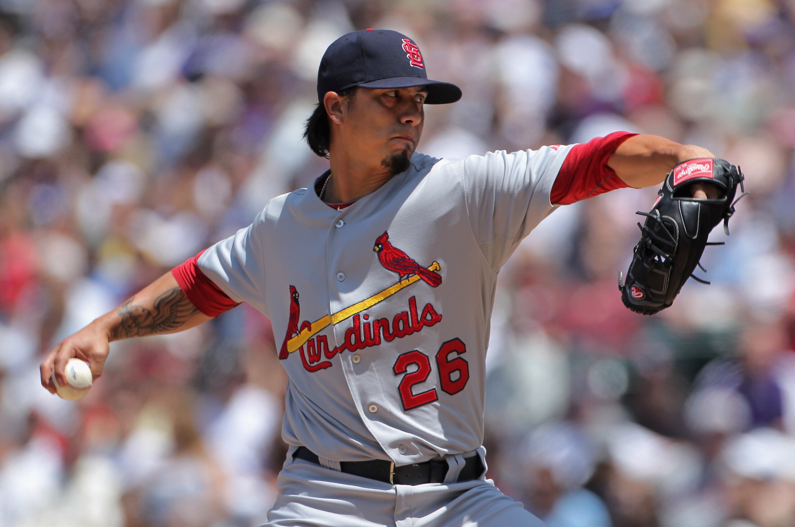 DENVER, CO - MAY 29:  Starting pitcher Kyle Lohse #26 of the St. Louis Cardinals delivers against the Colorado Rockies at Coors Field on May 29, 2011 in Denver, Colorado.  (Photo by Doug Pensinger/Getty Images)