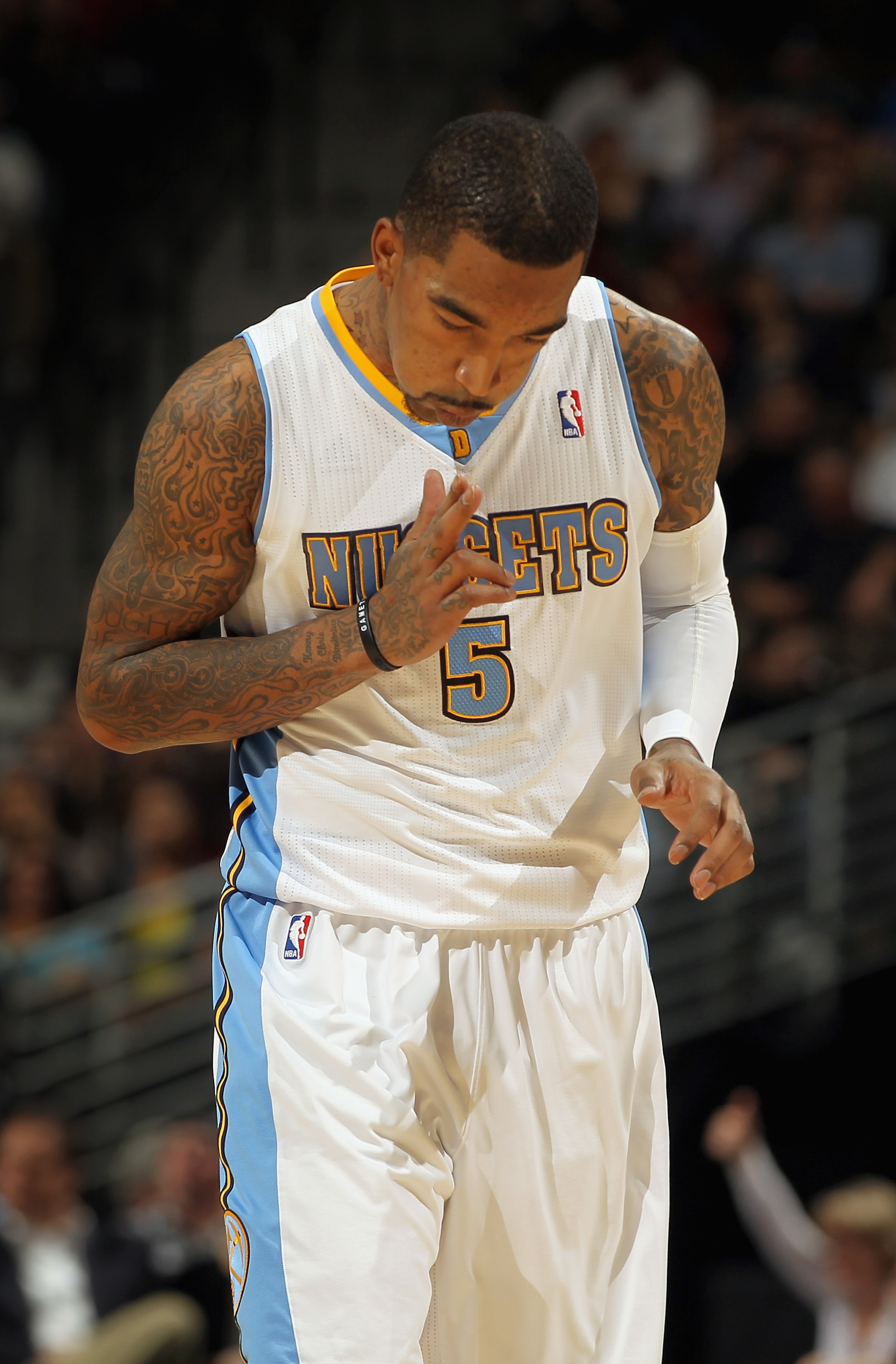 DENVER, CO - MARCH 02:  J.R. Smith #5 of the Denver Nuggets celebrates after scoring against the Charlotte Bobcats at the Pepsi Center on March 2, 2011 in Denver, Colorado. The Nuggets defeated the Bobcats 120-80.NOTE TO USER: User expressly acknowledges