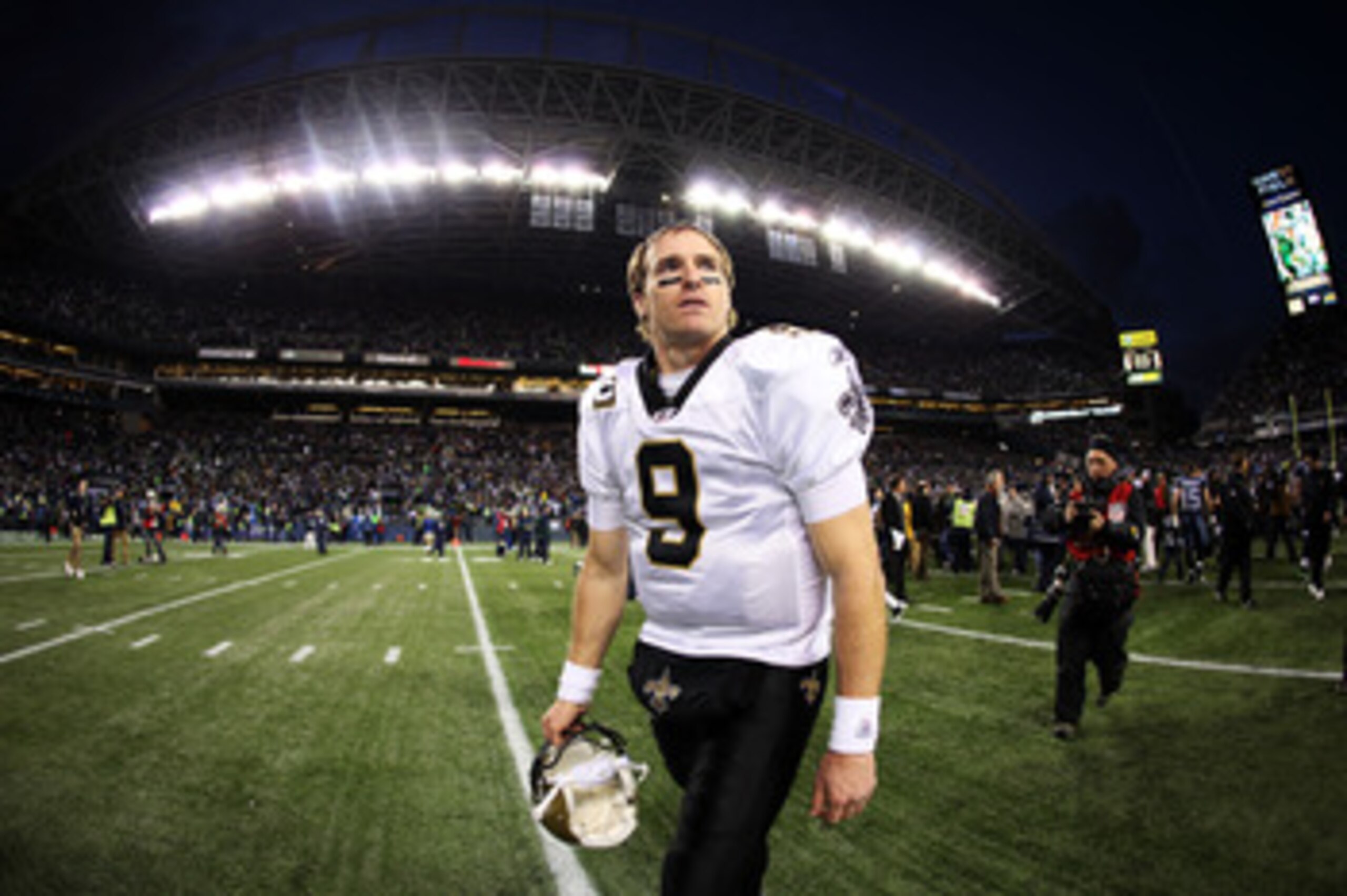 SEATTLE, WA - JANUARY 08: Quarterback Drew Brees #9 of the New Orleans Saints walks off the field after the Saints were defeated 41-36 by the Seattle Seahawks during the 2011 NFC wild-card playoff game at Qwest Field on January 8, 2011 in Seattle, Washin SEATTLE, WA - JANUARY 08: Quarterback Drew Brees #9 of the New Orleans Saints walks off the field after the Saints were defeated 41-36 by the Seattle Seahawks during the 2011 NFC wild-card playoff game at Qwest Field on January 8, 2011 in Seattle, Washin