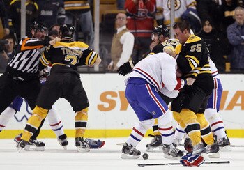 BOSTON, MA - FEBRUARY 09:  Johnny Boychuk #55 of the Boston Bruins fights with Jaroslav Spacek #6 of the Montreal Canadiens is Shawn Thornton #22 of the Bruins and Brian Gionta #21 of the Canadiens fight on February 9, 2011 at the TD Garden in Boston, Mas