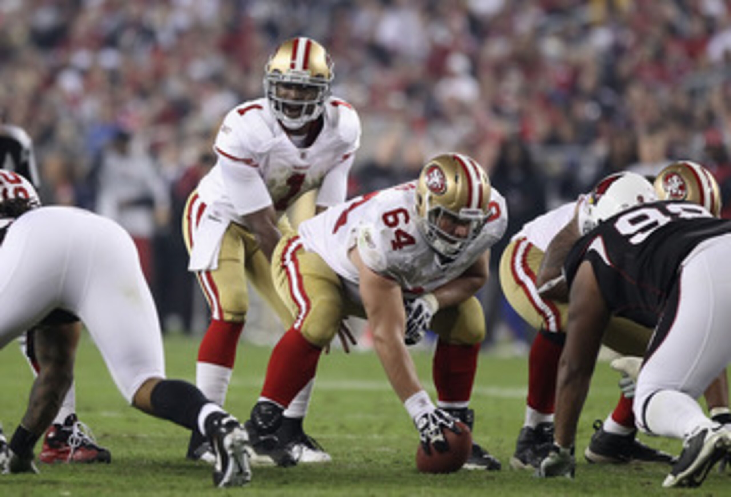 GLENDALE, AZ - NOVEMBER 29:  Center David Baas #64 of the San Francisco 49ers prepares to snap the football to Troy Smith #1 during the NFL game against the Arizona Cardinals at the University of Phoenix Stadium on November 29, 2010 in Glendale, Arizona.