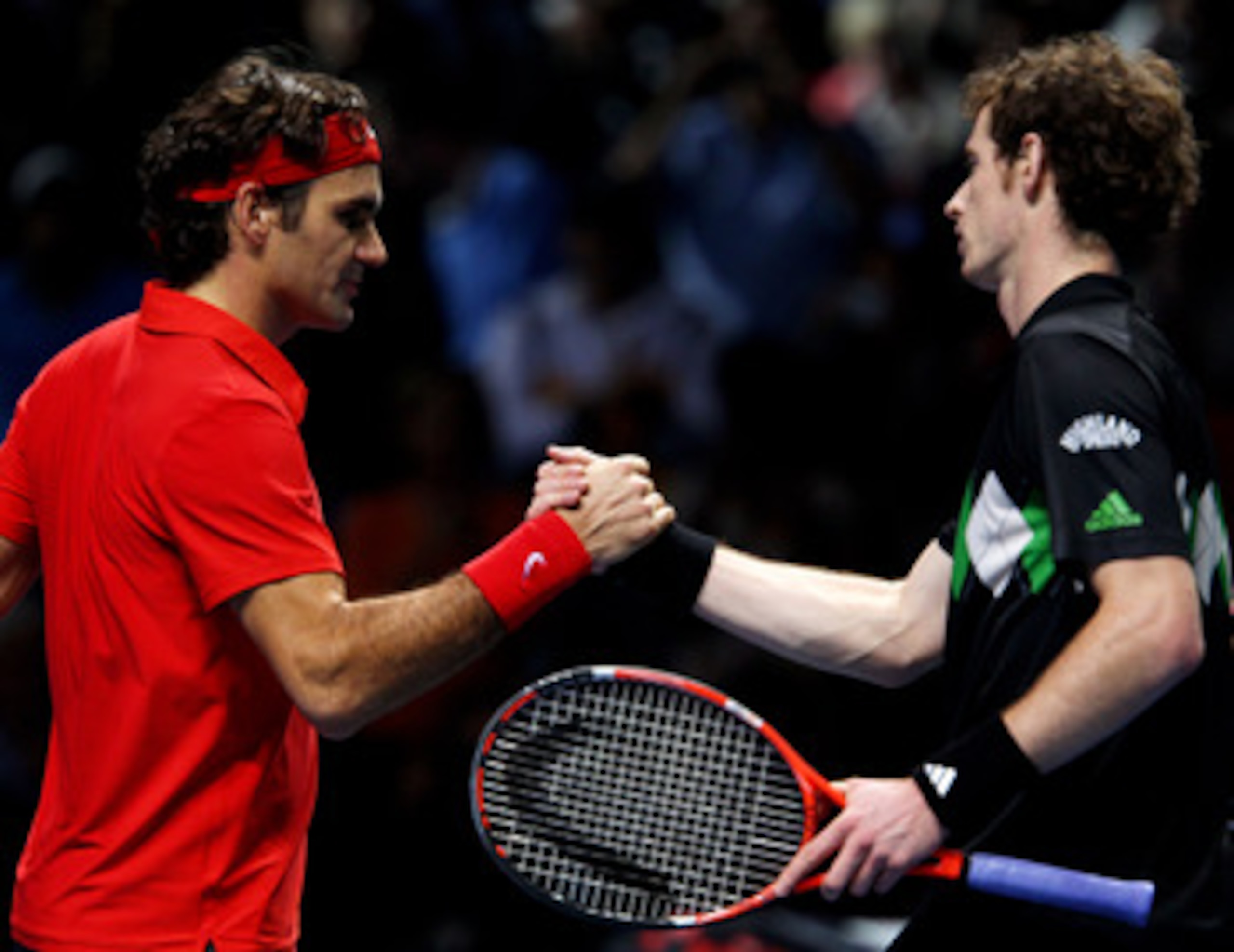 LONDON, ENGLAND - NOVEMBER 23:  Roger Federer (L) of Switzerland shakes hands with Andy Murray of Great Britain after winning his men's singles match during the ATP World Tour Finals at O2 Arena on November 23, 2010 in London, England.  (Photo by Clive Br