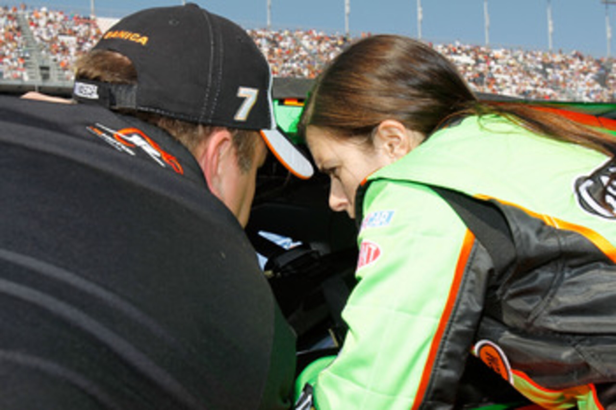 DAYTONA BEACH, FL - FEBRUARY 19:  Danica Patrick, driver of the #7 GoDaddy.com Chevrolet, talks to her crew chief Tony Eury Jr. on the grid prior to the NASCAR Nationwide Series DRIVE4COPD 300 at Daytona International Speedway on February 19, 2011 in Dayt