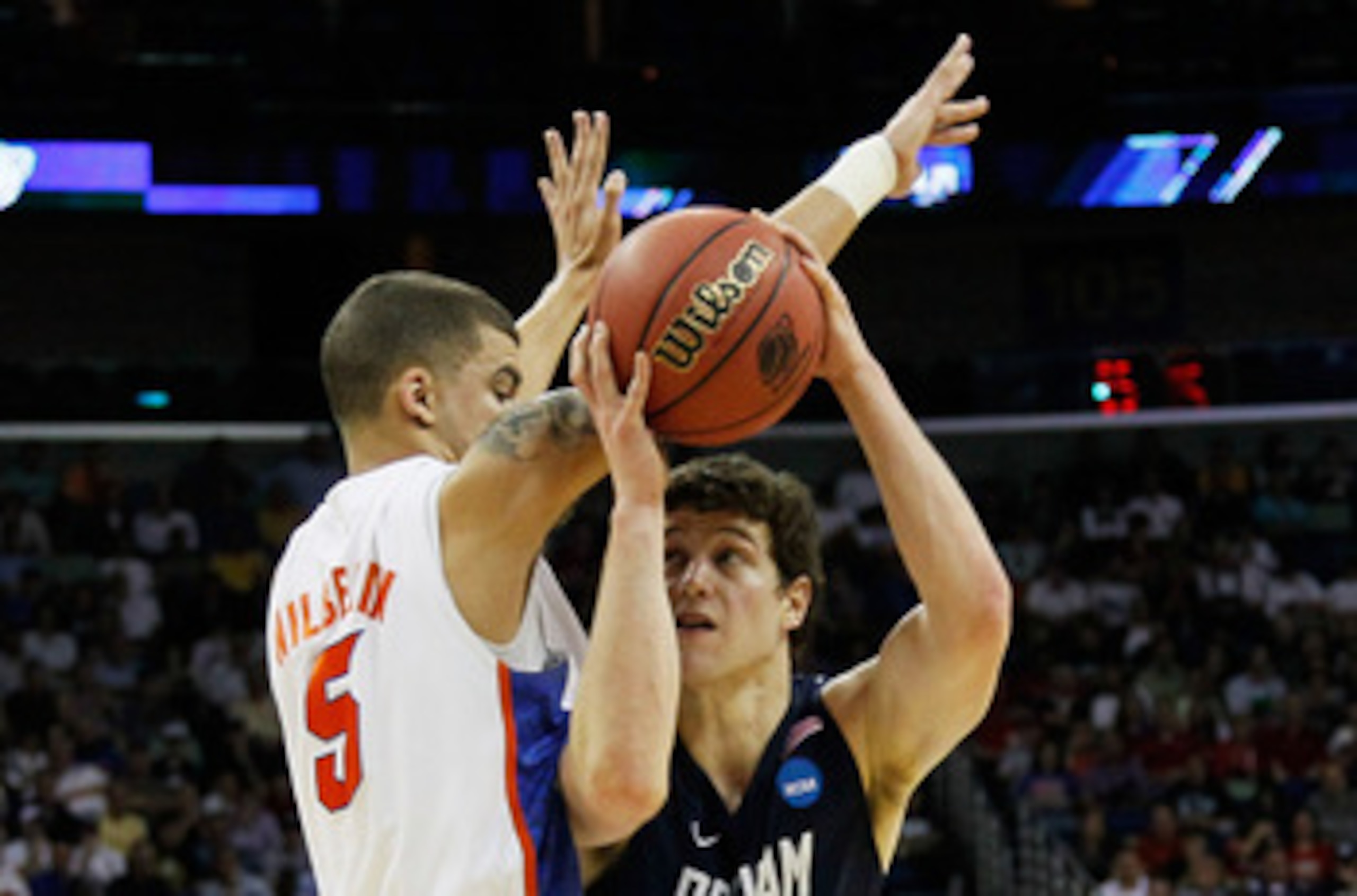 NEW ORLEANS, LA - MARCH 24:  Jimmer Fredette #32 of the Brigham Young Cougars goes up against Scottie Wilbekin #5 of the Florida Gators during the Southeast regional of the 2011 NCAA men's basketball tournament at New Orleans Arena on March 24, 2011 in Ne