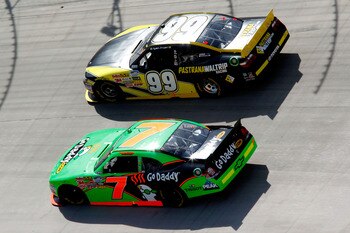 BRISTOL, TN - MARCH 19:  Danica Patrick, driver of the #7 GoDaddy.com Chevrolet, races Ryan Truex, driver of the #99 Pastrana Waltrip Racing Toyota, during the NASCAR Nationwide Series Scotts EZ Seed 300 at Bristol Motor Speedway on March 19, 2011 in Bris