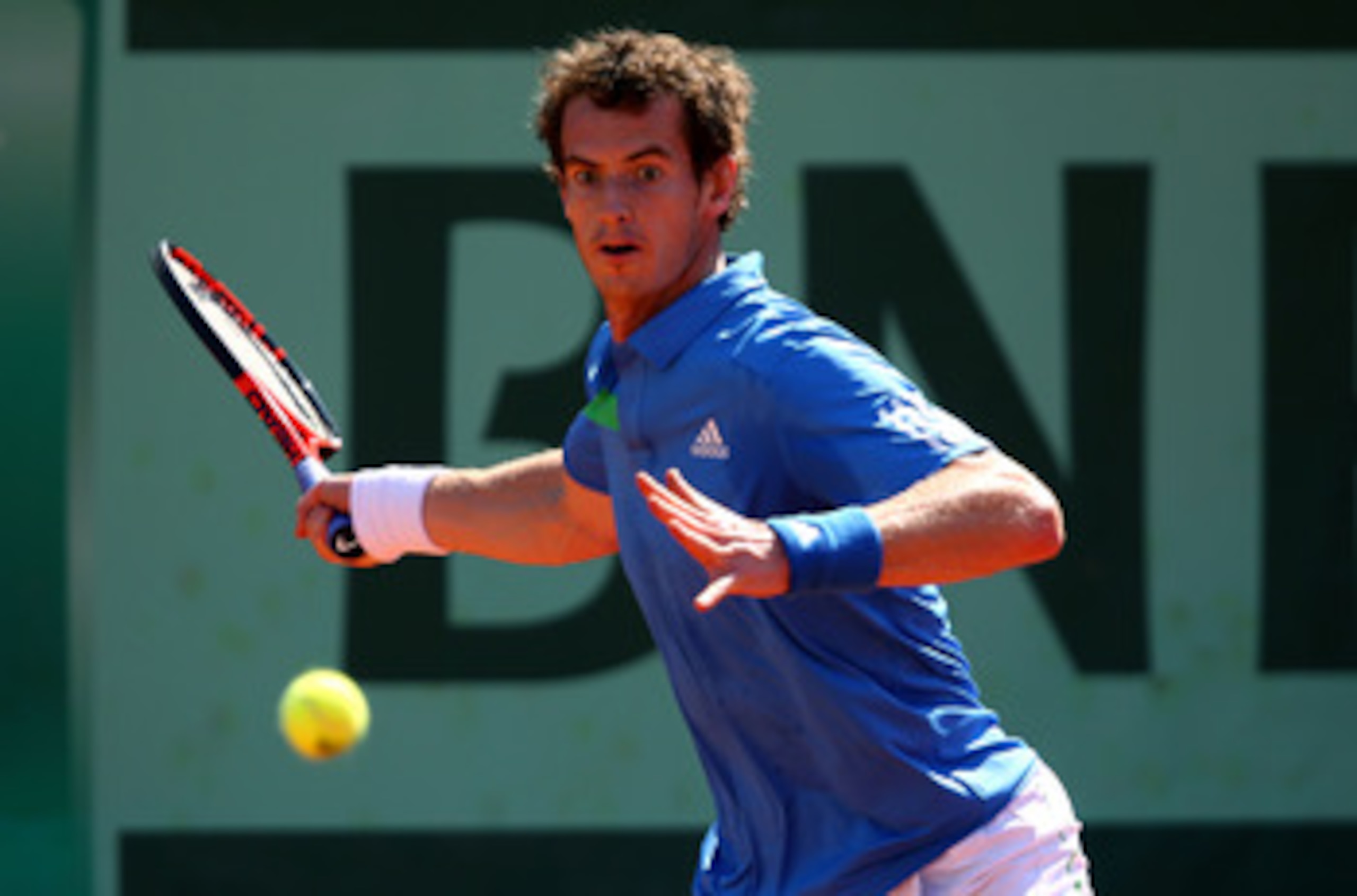 PARIS, FRANCE - JUNE 01:  Andy Murray of Great Britain hits a forehand during the men's singles quarterfinal match between Andy Murray of Great Britain and Juan Ignacio Chela of Argentina on day eleven of the French Open at Roland Garros on June 1, 2011 i