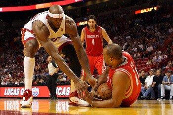 MIAMI, FL - MARCH 27: Center Erick Dampier #25 of the Miami Heat defends against Center Chuck Hayes #44 of the Houston Rockets  at American Airlines Arena on March 27, 2011 in Miami, Florida. NOTE TO USER: User expressly acknowledges and agrees that, by d