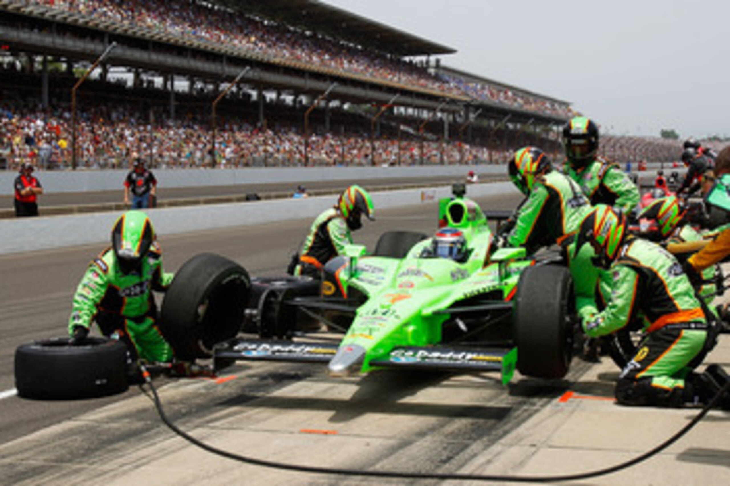 INDIANAPOLIS, IN - MAY 29:  Danica Patrick, driver of the #7 Team GoDaddy Dallara Honda, makes a pit stop during the IZOD IndyCar Series Indianapolis 500 Mile Race at Indianapolis Motor Speedway on May 29, 2011 in Indianapolis, Indiana.  (Photo by Todd Wa