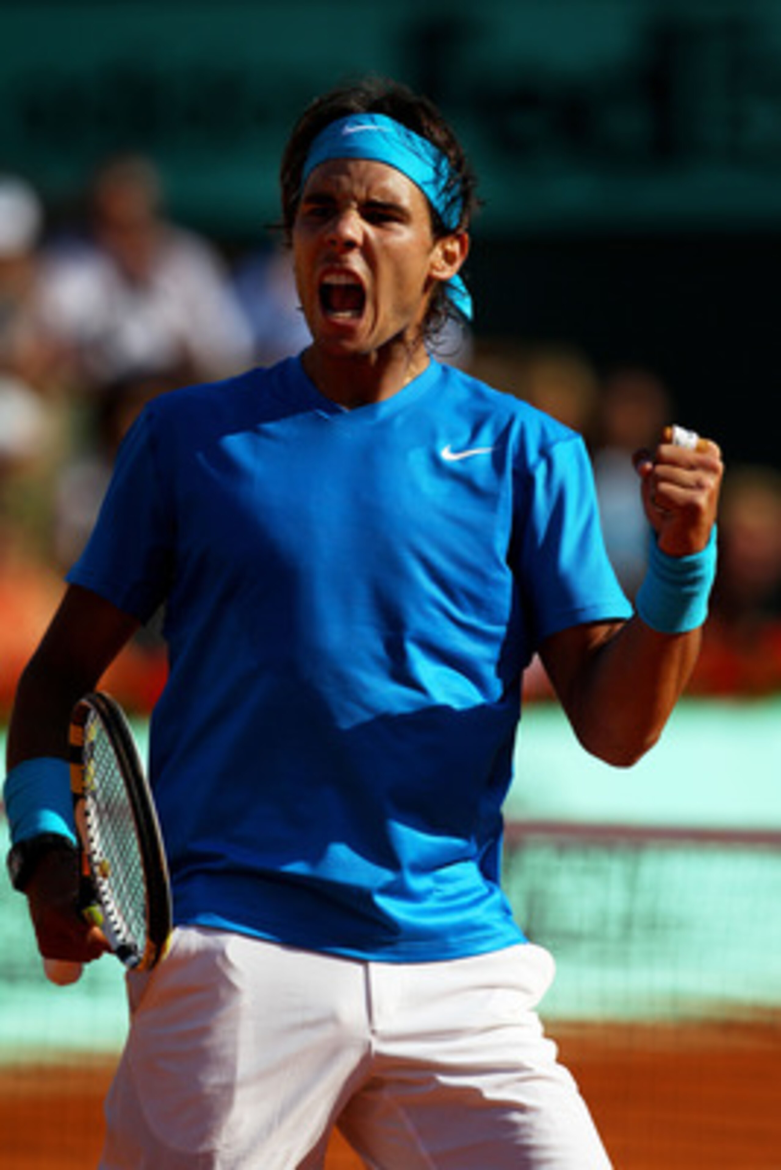 PARIS, FRANCE - JUNE 01:  Rafael Nadal of Spain celebrates a point during the men's singles quarterfinal match between Rafael Nadal of Spain and Robin Soderling of Sweden on day eleven of the French Open at Roland Garros on June 1, 2011 in Paris, France. 