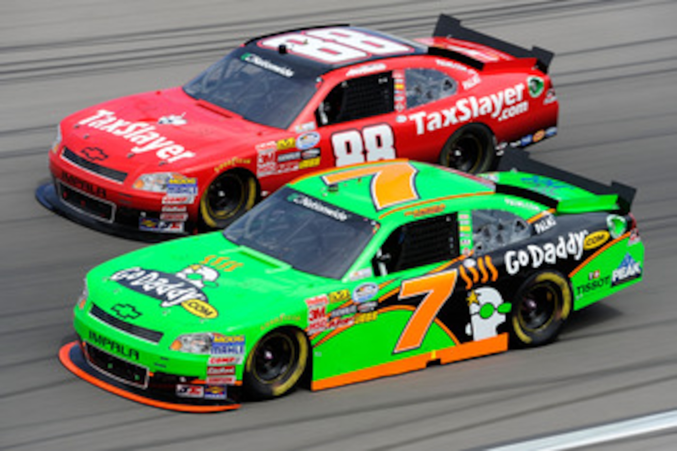 LAS VEGAS, NV - MARCH 05:  Danica Patrick, driver of the #7 GoDaddy.com Chevrolet, races Aric Almirola, driver of the #88 TaxSlayer.com Chevrolet, during the NASCAR Nationwide Series Sam's Town 300 at Las Vegas Motor Speedway on March 5, 2011 in Las Vegas