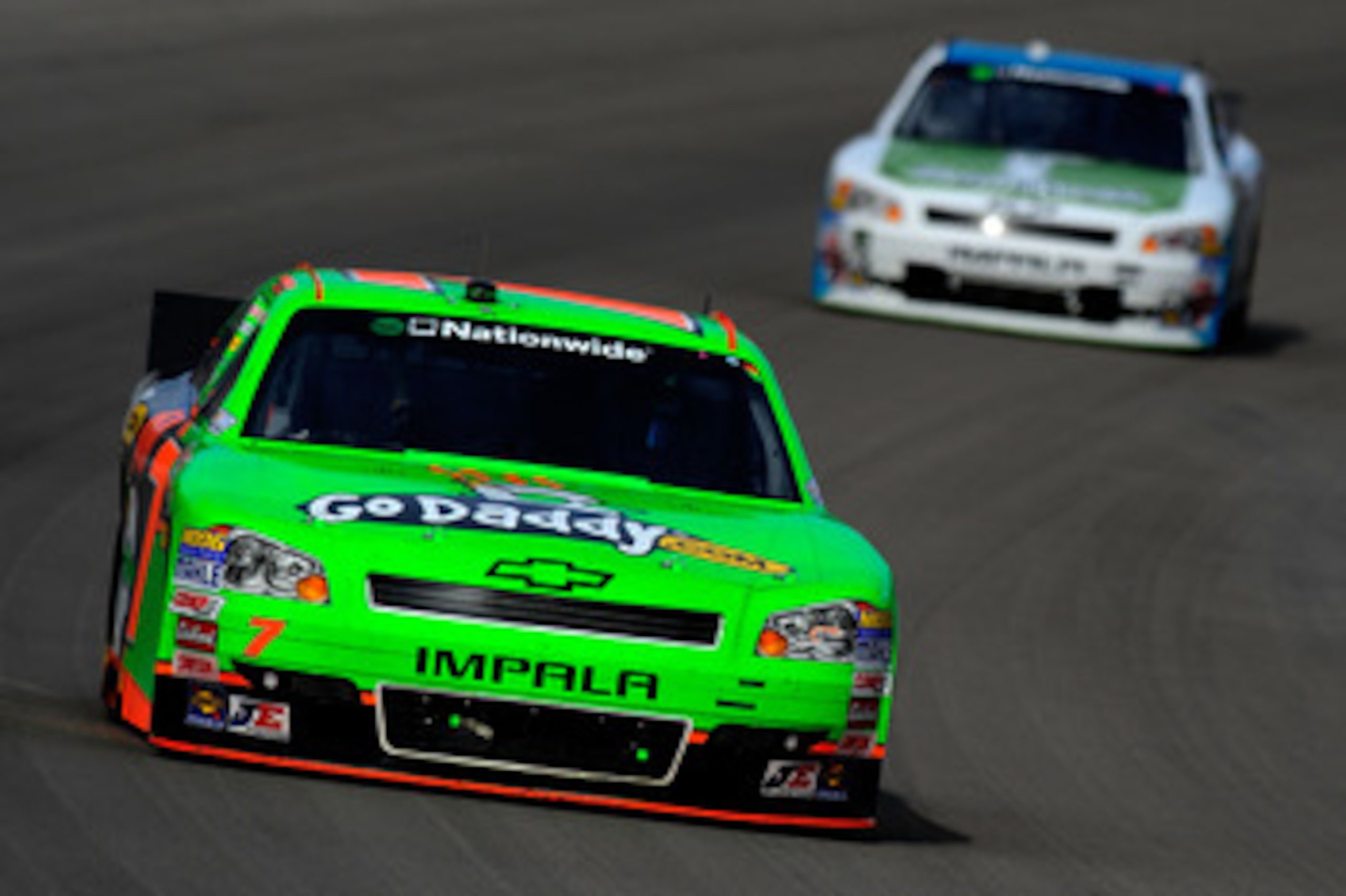 LAS VEGAS, NV - MARCH 05:  Danica Patrick, driver of the #7 GoDaddy.com Chevrolet, leads Mike Wallace, driver of the #01 HalfOffDeals.com Chevrolet, during the NASCAR Nationwide Series Sam's Town 300 at Las Vegas Motor Speedway on March 5, 2011 in Las Veg