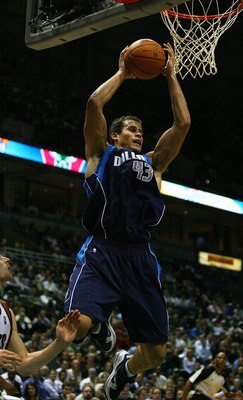 MILWAUKEE - NOVEMBER 16: Kris Humphries #43 of the Dallas Mavericks grabs a rebound against the Milwaukee Bucks defends at the Bradley Center on November 16, 2009 in Milwaukee, Wisconsin. The Mavericks defeated the Bucks 115-113 in overtime.  (Photo by Jo