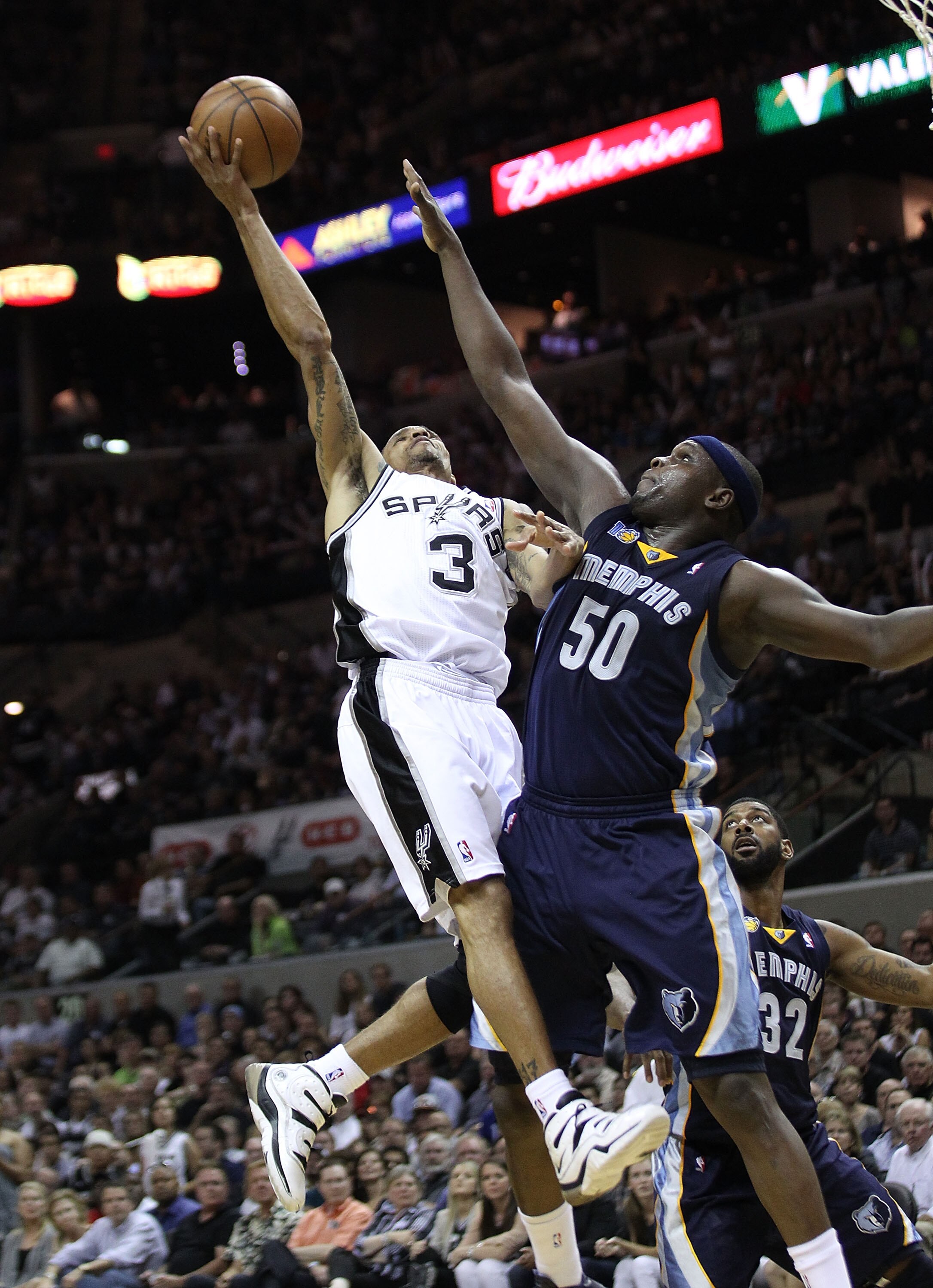 SAN ANTONIO, TX - APRIL 27:  George Hill #3 of the San Antionio Spurs shoots over Zach Randolph #50 of the Memphis Grizzlies in Game Five of the Western Conference Quarterfinals in the 2011 NBA Playoffs on April 27, 2011 at AT&T Center in San Antonio, Tex