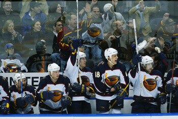 ATLANTA - JANUARY 15:  Brad Tapper #18 and his fellow the Atlanta Thrashers celebrate during the game against the Montreal Canadiens on January 15, 2002 at Phillips Arena in Atlanta, Georgia. The Thrashers defeated the Canadiens 1-0.  (Photo by Jamie Squi