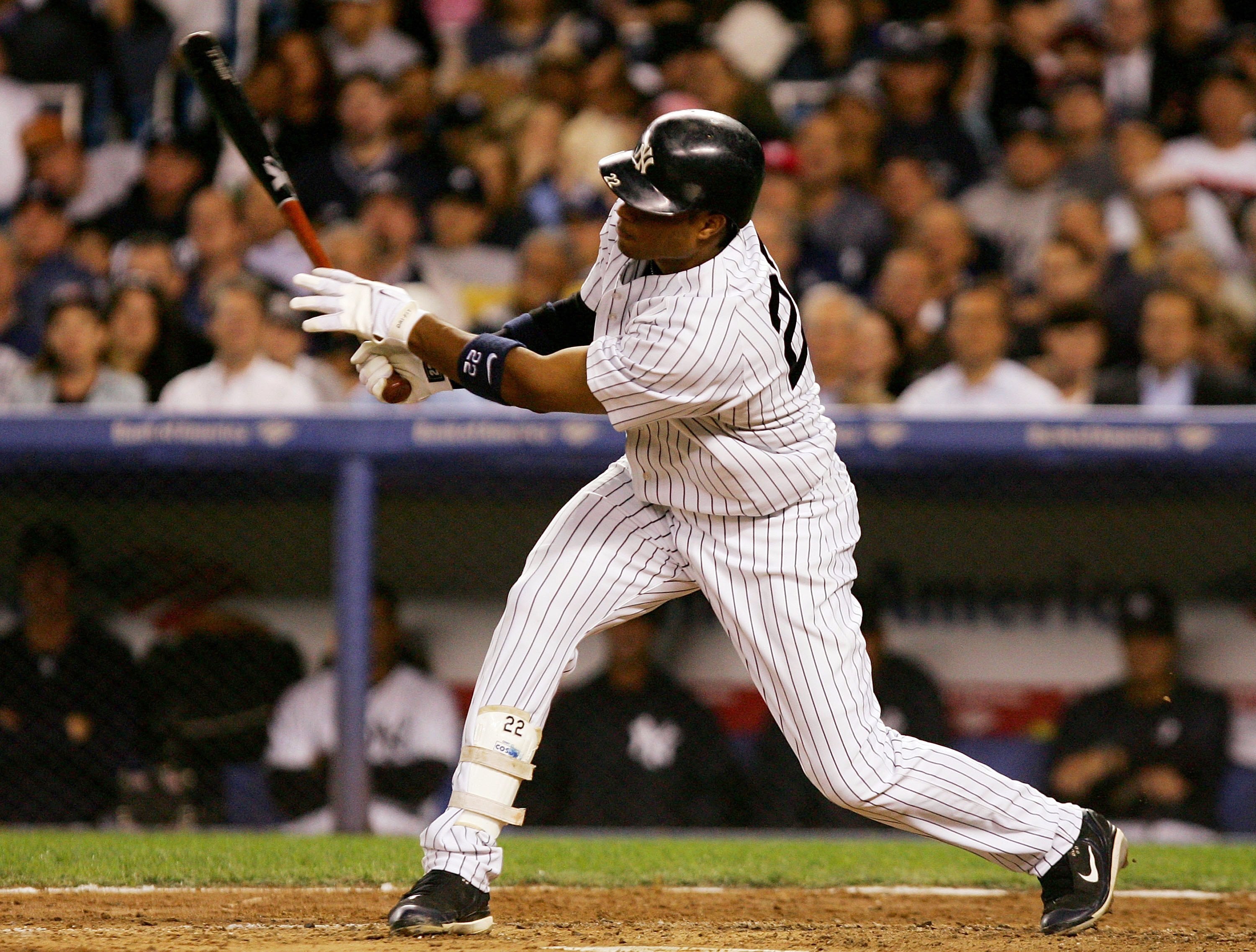 NEW YORK - SEPTEMBER 13:  Robinson Cano #22 of the New York Yankees follows through on a third inning two run home run against the Tampa Bay Devil Rays on September 13, 2006 at Yankee Stadium in the Bronx borough of New York City.  (Photo by Jim McIsaac/G