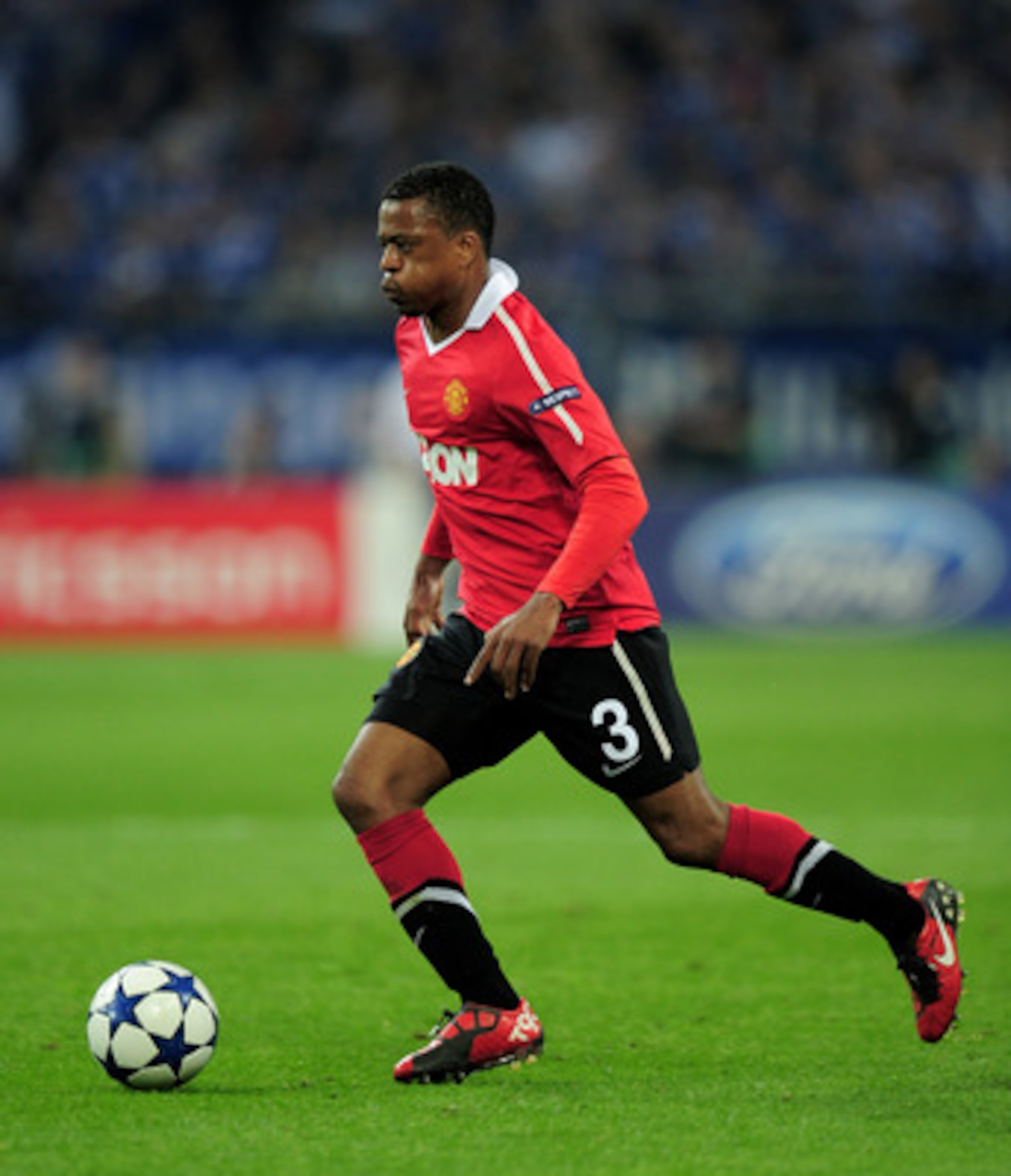 GELSENKIRCHEN, GERMANY - APRIL 26: Patrice Evra of Manchester United in action during the UEFA Champions League Semi Final first leg match between FC Schalke 04 and Manchester United at Veltins Arena on April 26, 2011 in Gelsenkirchen, Germany. (Photo b GELSENKIRCHEN, GERMANY - APRIL 26: Patrice Evra of Manchester United in action during the UEFA Champions League Semi Final first leg match between FC Schalke 04 and Manchester United at Veltins Arena on April 26, 2011 in Gelsenkirchen, Germany. (Photo b