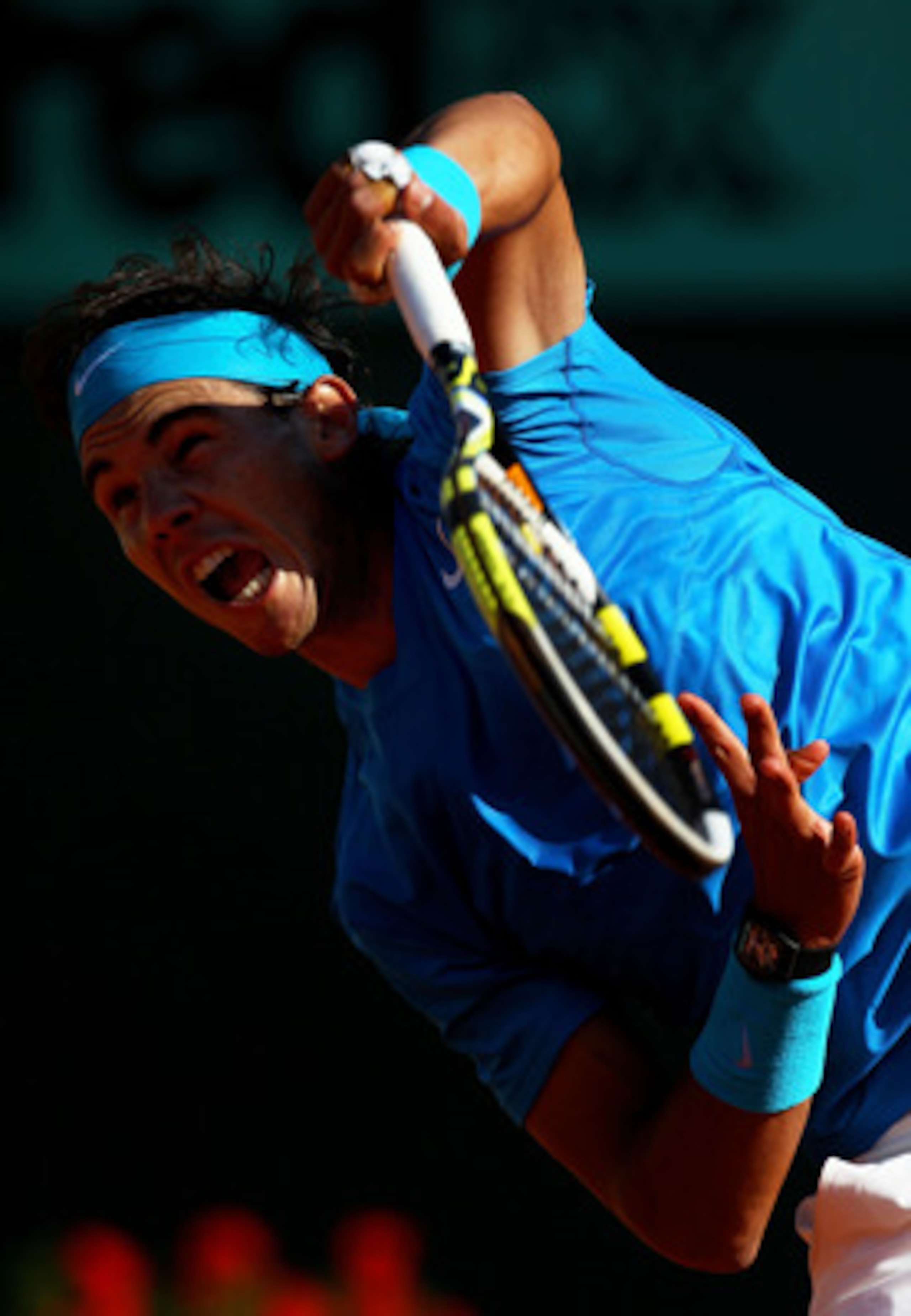 PARIS, FRANCE - JUNE 01:  Rafael Nadal of Spain serves during the men's singles quarterfinal match between Rafael Nadal of Spain and Robin Soderling of Sweden on day eleven of the French Open at Roland Garros on June 1, 2011 in Paris, France.  (Photo by A