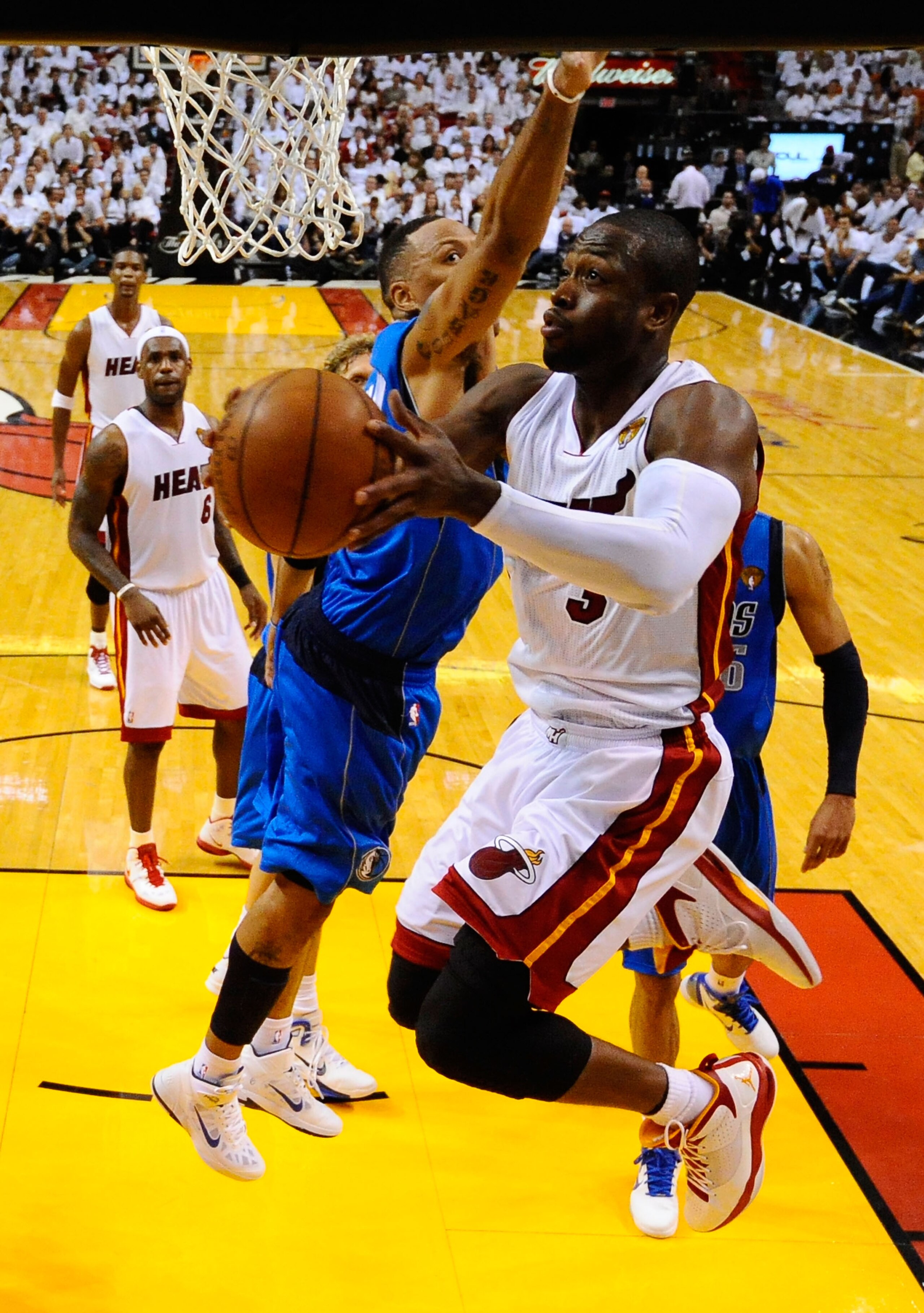 MIAMI, FL - MAY 31:  Dwyane Wade #3 of the Miami Heat drives for a shot attempt against Shawn Marion #0 of the Dallas Mavericks in Game One of the 2011 NBA Finals at American Airlines Arena on May 31, 2011 in Miami, Florida. NOTE TO USER: User expressly a