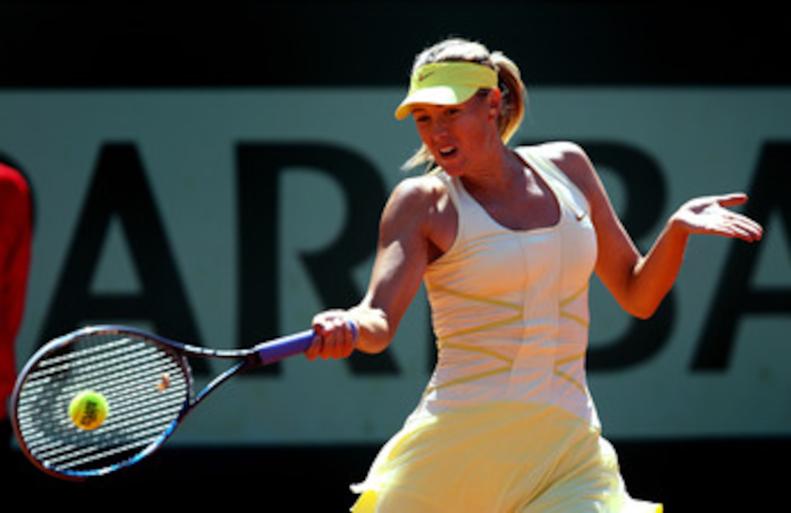 PARIS, FRANCE - JUNE 01: Maria Sharapova of Russia hits a forehand during the women's singles quarterfinal match between Maria Sharapova of Russia and Andrea Petkovic of Germany on day eleven of the French Open at Roland Garros on June 1, 2011 in Paris, PARIS, FRANCE - JUNE 01: Maria Sharapova of Russia hits a forehand during the women's singles quarterfinal match between Maria Sharapova of Russia and Andrea Petkovic of Germany on day eleven of the French Open at Roland Garros on June 1, 2011 in Paris,
