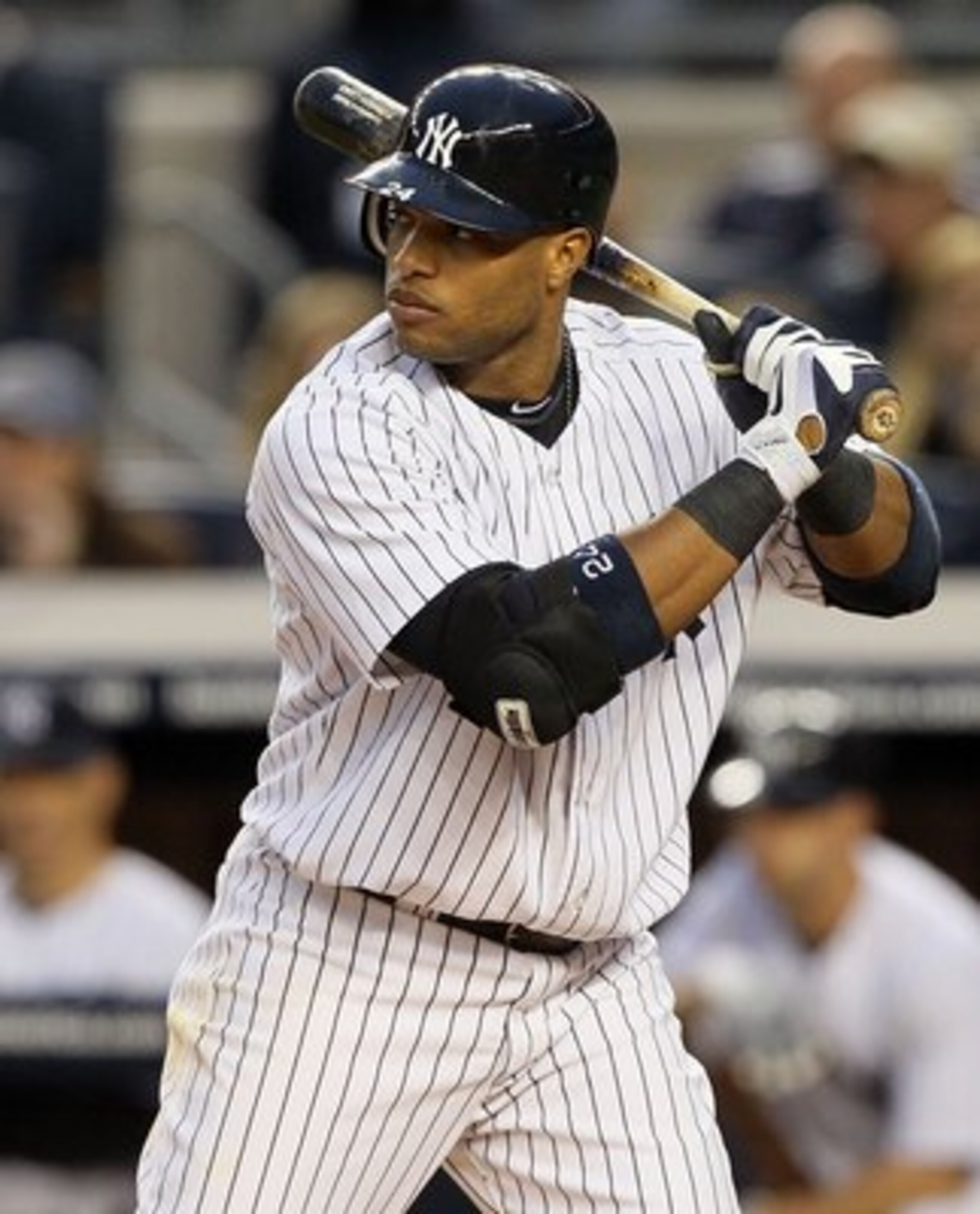 NEW YORK, NY - MAY 14:  Robinson Cano #24 of the New York Yankees bats against the Boston Red Sox on May 14, 2011 at Yankee Stadium in the Bronx borough of New York City.  (Photo by Jim McIsaac/Getty Images)