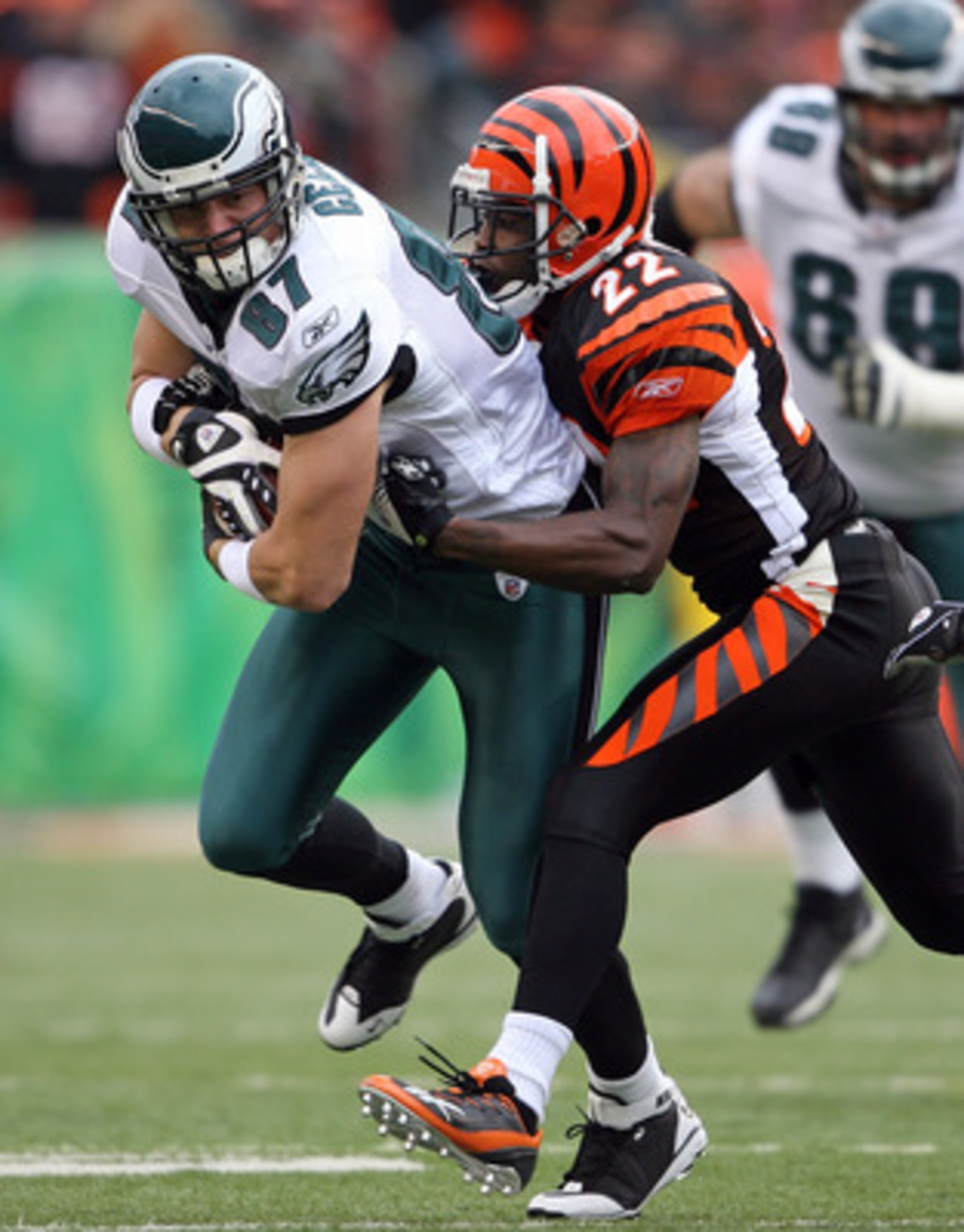 CINCINNATI - NOVEMBER 16:  Brent Celek #87 of the Philadelphia Eagles runs with the ball while tackled by Johnathan Joseph #22 of the Cincinnati Bengals during the NFL game at Paul Brown Stadium on November 16, 2008 in Cincinnati, Ohio.  The game ended in