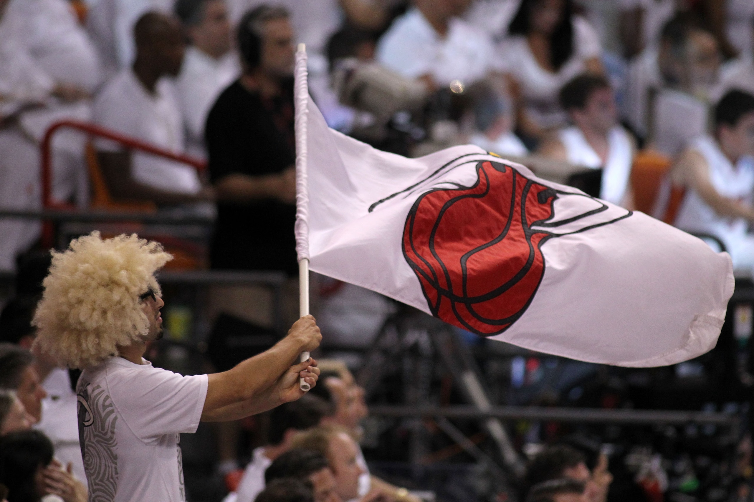 MIAMI, FL - MAY 31:  A Miami Heat fan waves a flag in the second half while the Heat take on the Dallas Mavericks in Game One of the 2011 NBA Finals at American Airlines Arena on May 31, 2011 in Miami, Florida. NOTE TO USER: User expressly acknowledges an