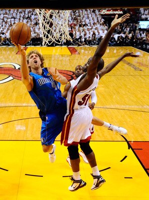 MIAMI, FL - MAY 31: Dirk Nowitzki #41 of the Dallas Mavericks goes up for a shot against Joel Anthony #50 of the Miami Heat in the first half in Game One of the 2011 NBA Finals at American Airlines Arena on May 31, 2011 in Miami, Florida. NOTE TO USER: U MIAMI, FL - MAY 31: Dirk Nowitzki #41 of the Dallas Mavericks goes up for a shot against Joel Anthony #50 of the Miami Heat in the first half in Game One of the 2011 NBA Finals at American Airlines Arena on May 31, 2011 in Miami, Florida. NOTE TO USER: U