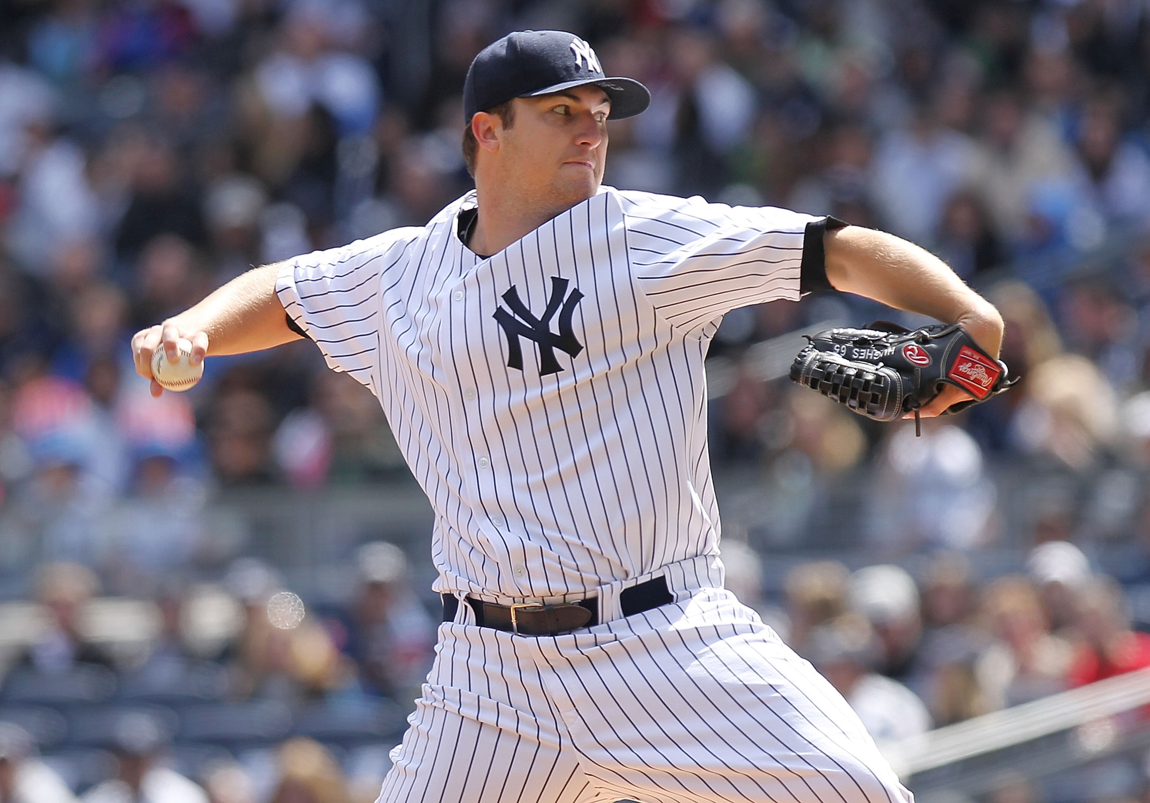NEW YORK, NY - APRIL 03:  Phil Hughes #65 of the New York Yankees pitches against the Detroit Tigers at Yankee Stadium on April 3, 2011 in the Bronx borough of New York City.  (Photo by Nick Laham/Getty Images)