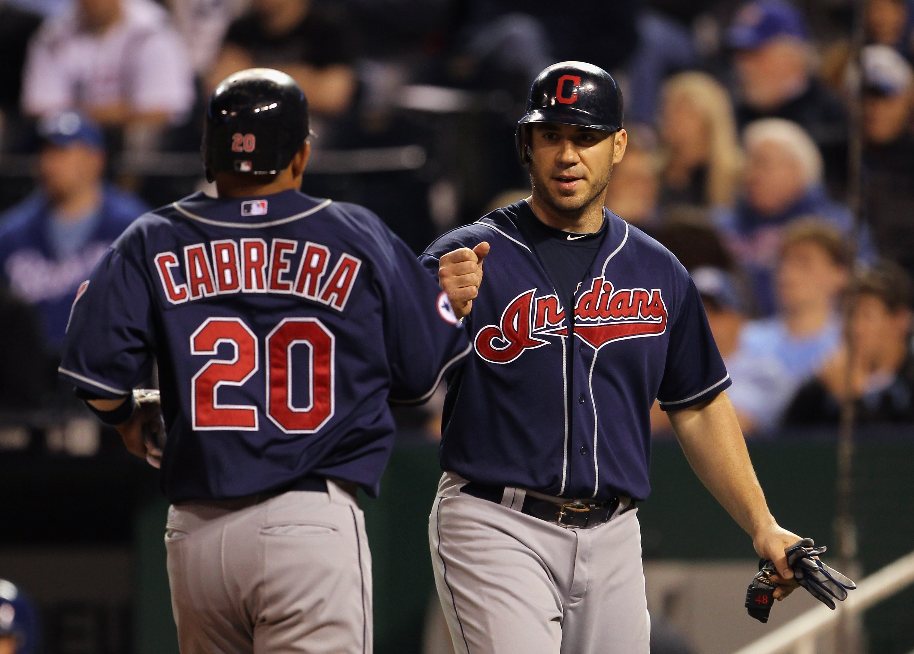 KANSAS CITY, MO - MAY 16: Orlando Cabrera #20 of the Cleveland Indians is congratulated by Travis Hafner #48 after scoring during the game against the Kansas City Royals on May 16, 2011 at Kauffman Stadium in Kansas City, Missouri. (Photo by Jamie Squir KANSAS CITY, MO - MAY 16: Orlando Cabrera #20 of the Cleveland Indians is congratulated by Travis Hafner #48 after scoring during the game against the Kansas City Royals on May 16, 2011 at Kauffman Stadium in Kansas City, Missouri. (Photo by Jamie Squir
