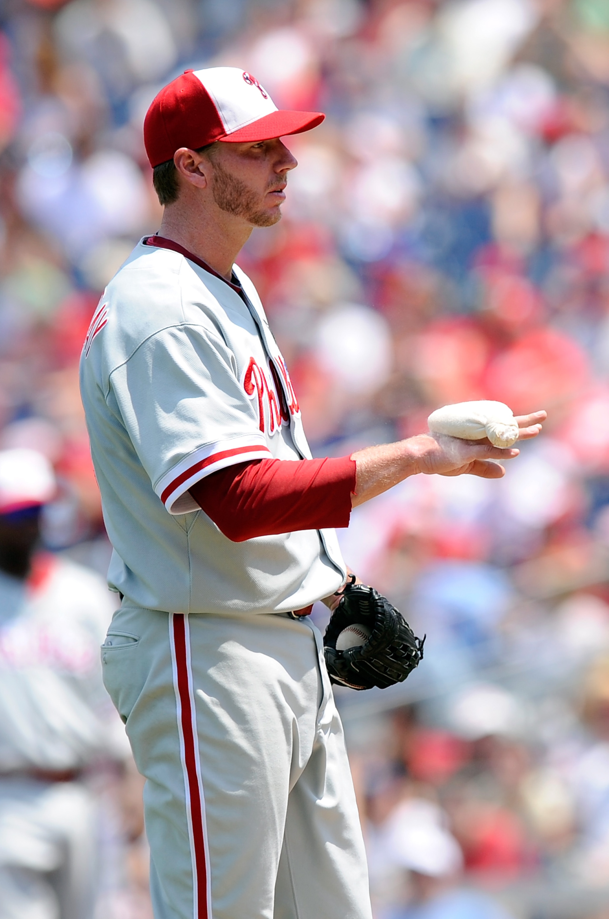 WASHINGTON, DC - MAY 30:  Roy Halladay #34 of the Philadelphia Phillies uses the rosin bag during the game against the Washington Nationals at Nationals Park on May 30, 2011 in Washington, DC.  (Photo by Greg Fiume/Getty Images)