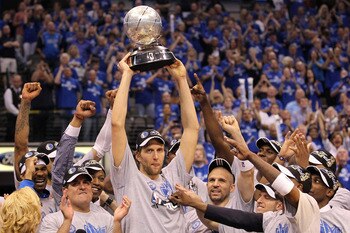DALLAS, TX - MAY 25: Dirk Nowitzki #41 and the Dallas Mavericks celebrate their 100-96 victory against the Oklahoma City Thunder in Game Five of the Western Conference Finals during the 2011 NBA Playoffs at American Airlines Center on May 25, 2011 in Dal DALLAS, TX - MAY 25: Dirk Nowitzki #41 and the Dallas Mavericks celebrate their 100-96 victory against the Oklahoma City Thunder in Game Five of the Western Conference Finals during the 2011 NBA Playoffs at American Airlines Center on May 25, 2011 in Dal