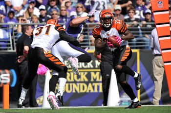 BALTIMORE - OCTOBER 11:  Johnathan Joseph #22 of the Cincinnati Bengals makes an interception near the end zone against the Baltimore Ravens at M&T Bank Stadium on October 11, 2009 in Baltimore, Maryland. The Bengals defeated the Ravens 17-14. (Photo by L