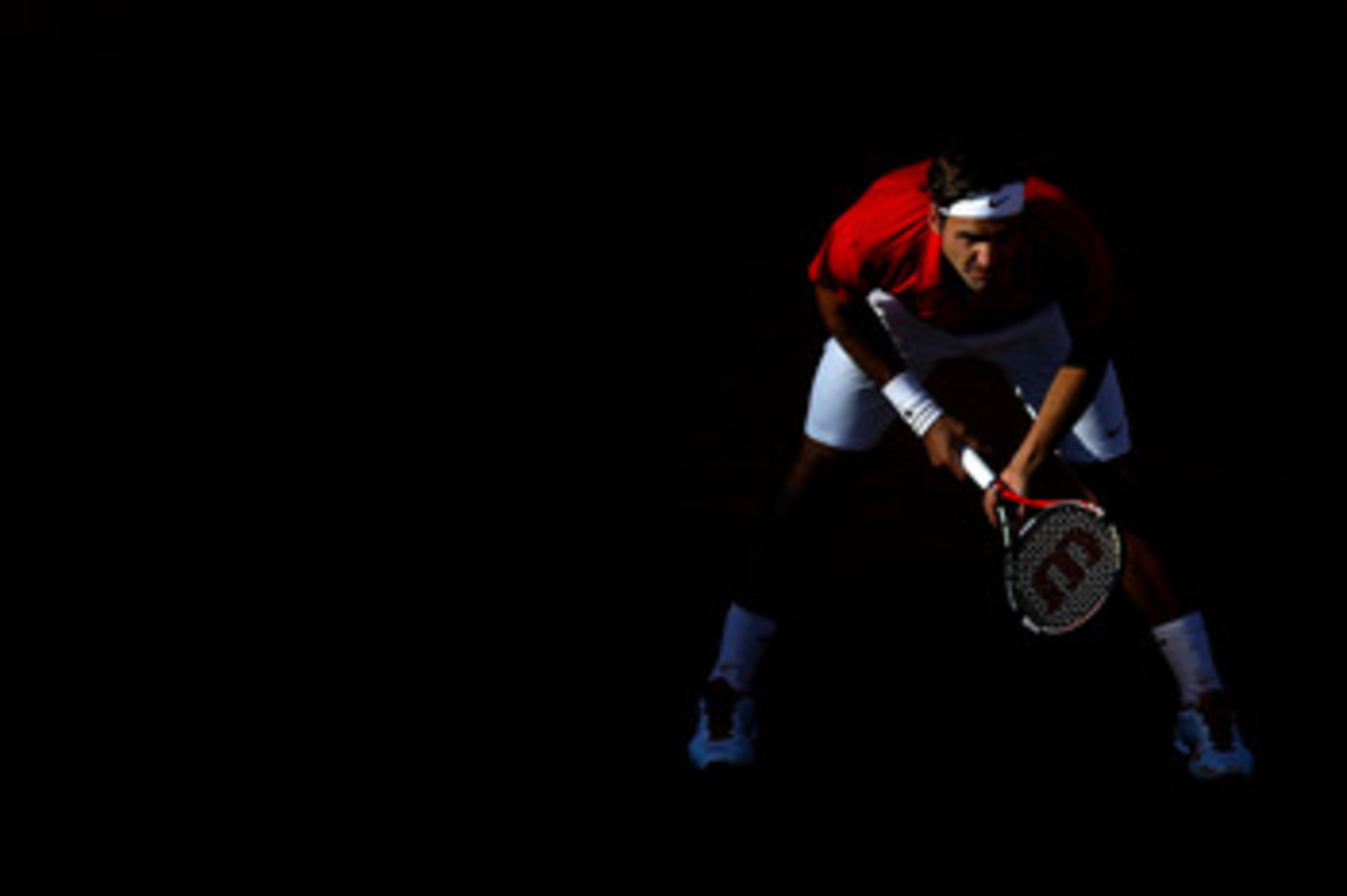 PARIS, FRANCE - MAY 31:  Roger Federer of Switzerland awaits a serve during the men's singles quarterfinal match between Gael Monfils of France and Roger Federer of Switzerland on day ten of the French Open at Roland Garros on May 31, 2011 in Paris, Franc