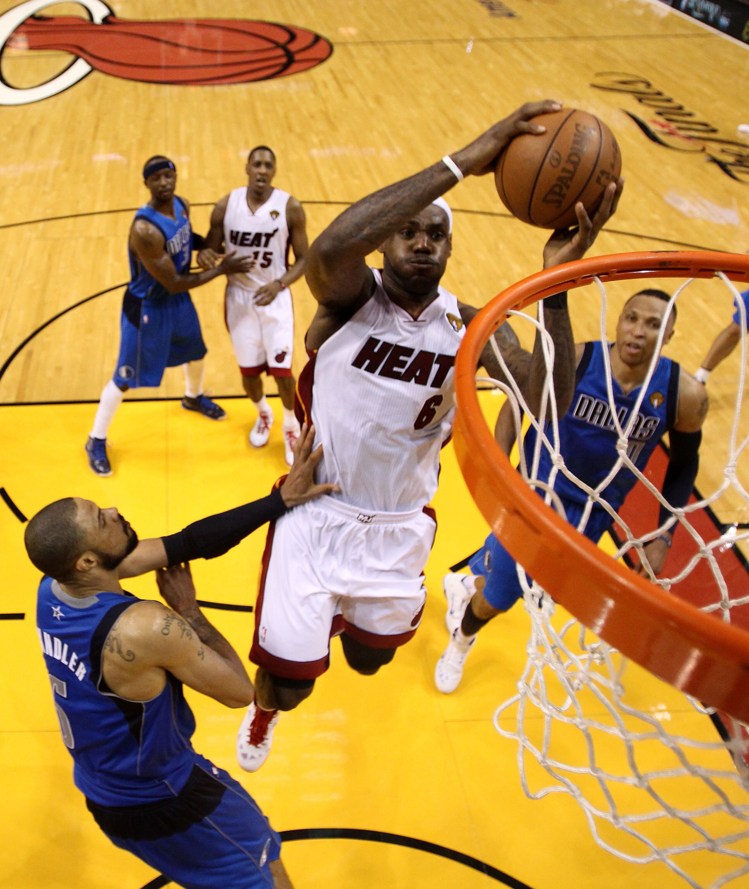 MIAMI, FL - MAY 31: LeBron James #6 of the Miami Heat dunks the ball over Tyson Chandler #6 of the Dallas Mavericks in the fourth quarter in Game One of the 2011 NBA Finals at American Airlines Arena on May 31, 2011 in Miami, Florida. NOTE TO USER: User MIAMI, FL - MAY 31: LeBron James #6 of the Miami Heat dunks the ball over Tyson Chandler #6 of the Dallas Mavericks in the fourth quarter in Game One of the 2011 NBA Finals at American Airlines Arena on May 31, 2011 in Miami, Florida. NOTE TO USER: User