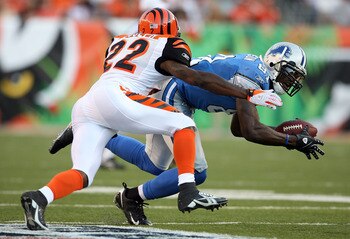 CINCINNATI - AUGUST 17:  Calvin Johnson #81 of the Detoit Lions catches a pass while defended by Johnathan Joseph #22 of the Cincinnati Bengals during the NFL game against  at Paul Brown Stadium on August 17, 2008 in Cincinnati, Ohio.  (Photo by Andy Lyon