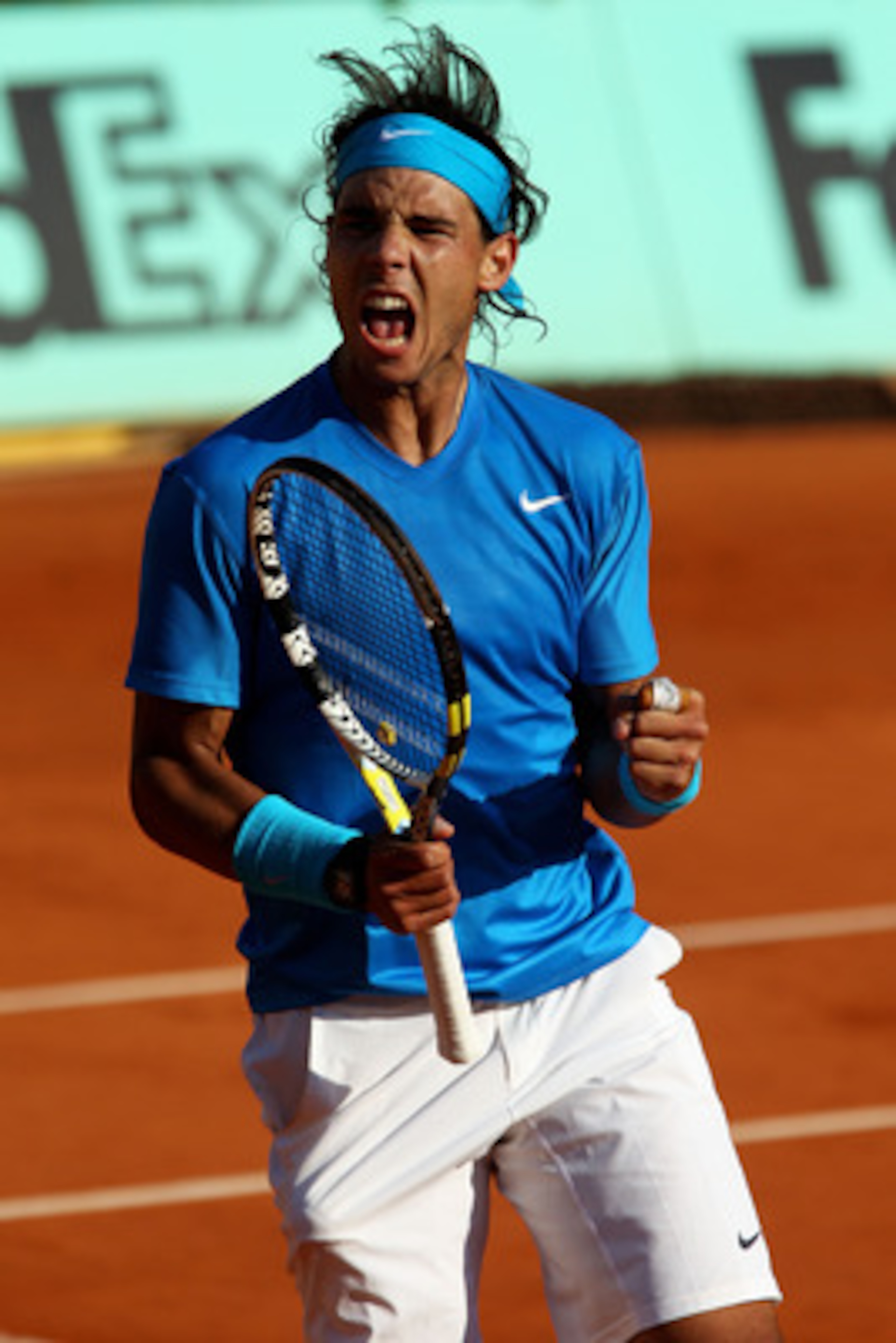 PARIS, FRANCE - JUNE 01:  Rafael Nadal of Spain celebrates a point during the men's singles quarterfinal match between Rafael Nadal of Spain and Robin Soderling of Sweden on day eleven of the French Open at Roland Garros on June 1, 2011 in Paris, France. 