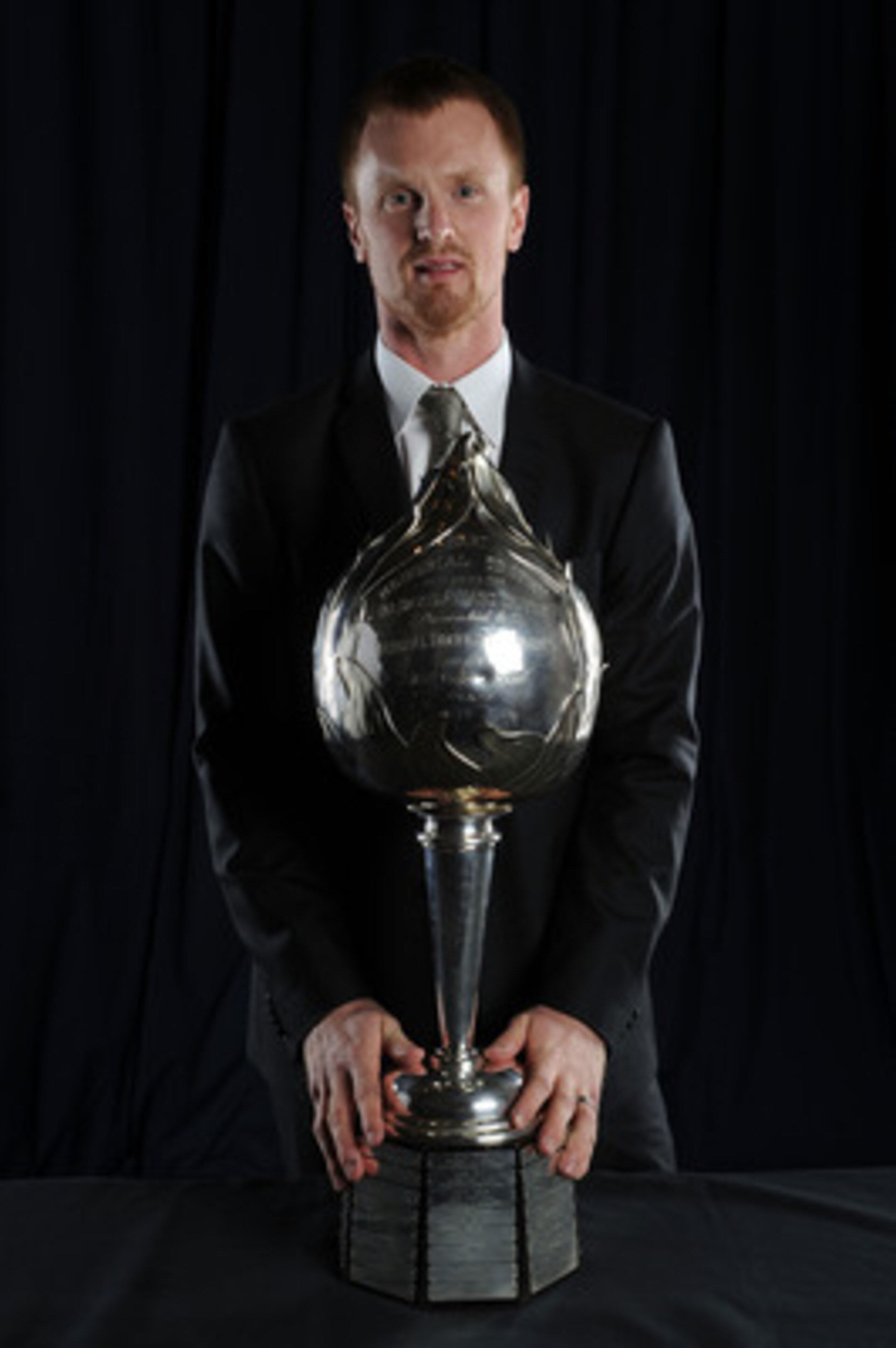 LAS VEGAS - JUNE 23:  Henrik Sedin of the Vancouver Canucks poses for a portrait with the Hart Memorial Trophy during the 2010 NHL Awards at the Palms Casino Resort on June 23, 2010 in Las Vegas, Nevada.  (Photo by Harry How/Getty Images)
