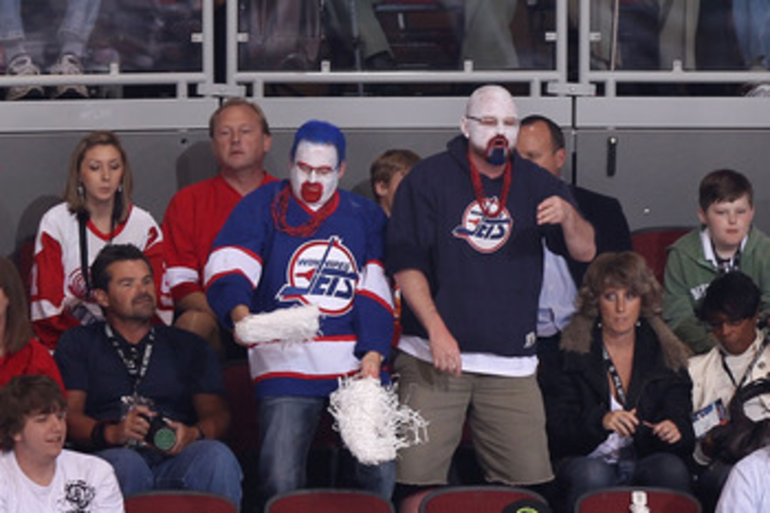 GLENDALE, AZ - APRIL 20:  Fans dressed in Winnipeg Jets uniforms attend Game Four of the Western Conference Quarterfinals between the Detroit Red Wings and the Phoenix Coyotes during the 2011 NHL Stanley Cup Playoffs at Jobing.com Arena on April 20, 2011