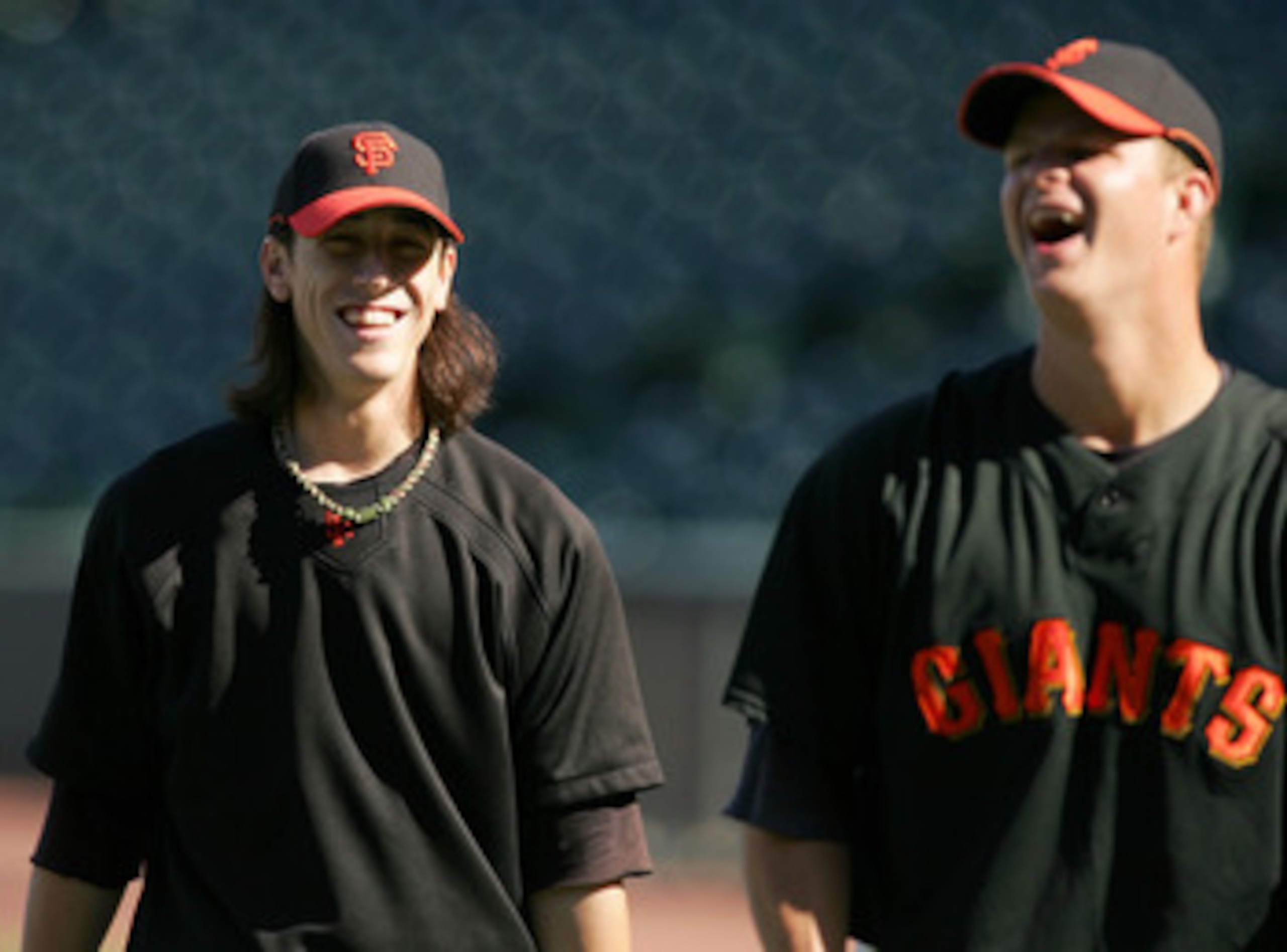 SAN FRANCISCO - AUGUST 26:  Tim Lincecum #55 of the San Francisco Giants jokes with Matt Cain #18 during batting practice before their game against the Arizona Diamondbacks at AT&T Park on August 26, 2009 in San Francisco, California.  (Photo by Ezra Shaw