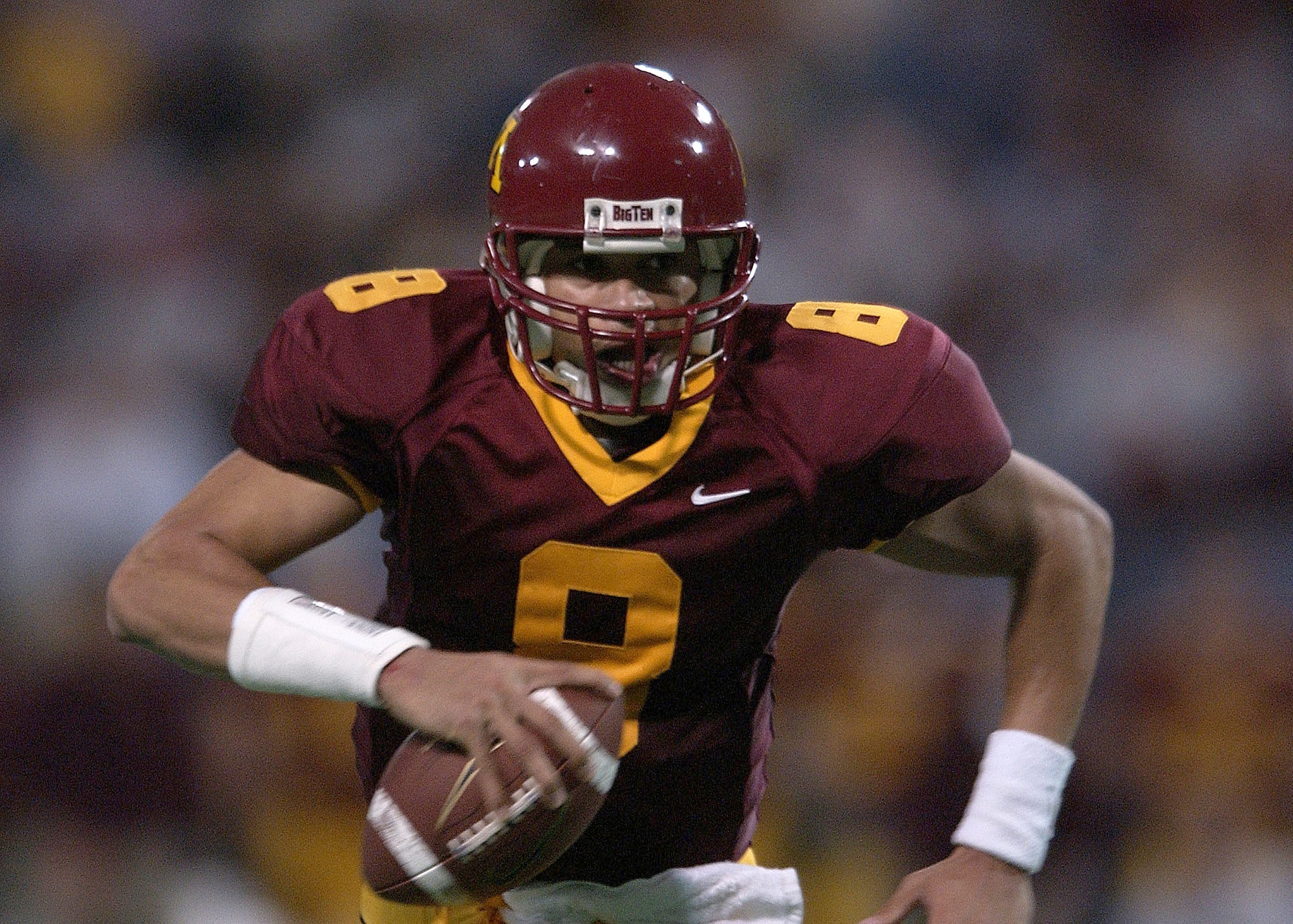 24 Nov 2001:  Quarterback Asad Abdul-Khaliq #8 of Minnesota runs the ball in for a touchdown against Wisconsin at the Hubert H. Humphrey Metrodome in Minneapolis, Minnesota. The Gophers beat the Badgers 42-31 to win Paul Bunyan's Axe. Wisconsin has held t