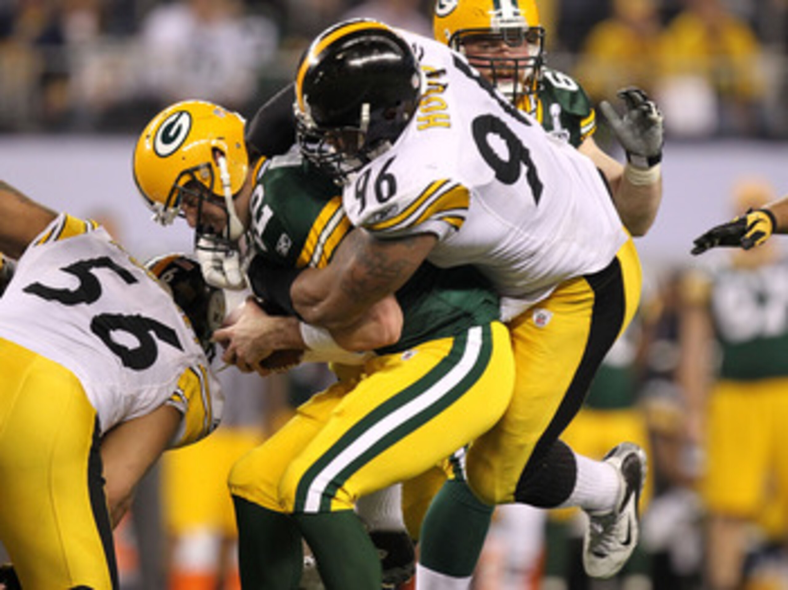 ARLINGTON, TX - FEBRUARY 06:  Aaron Rodgers #12 of the Green Bay Packers is sacked by Ziggy Hood #96 of the Pittsburgh Steelers during the fourth quarter of Super Bowl XLV at Cowboys Stadium on February 6, 2011 in Arlington, Texas.  (Photo by Ronald Marti