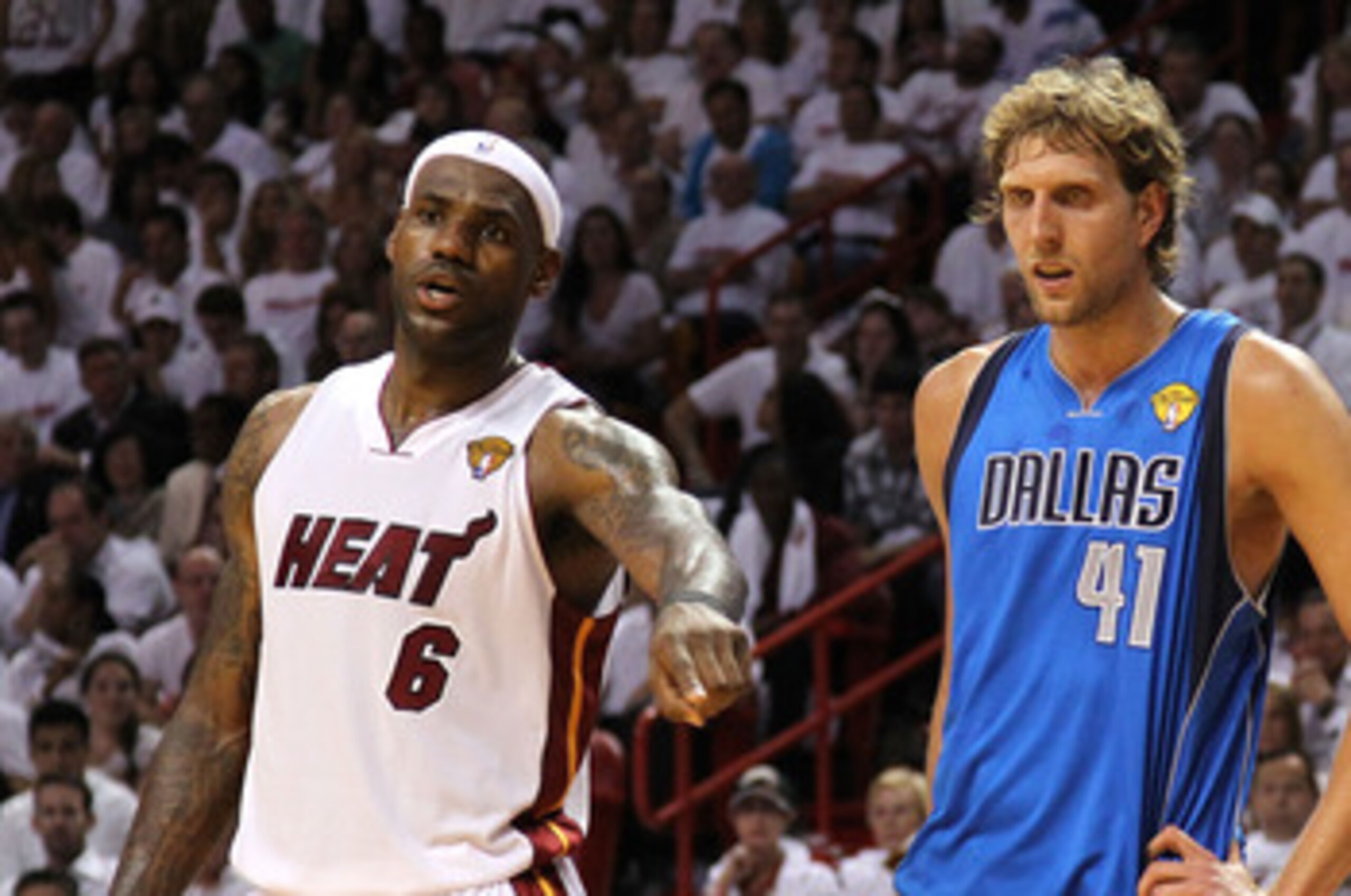 MIAMI, FL - MAY 31:  LeBron James #6 (L) and Udonis Haslem #40 of the Miami Heat look on as they Dirk Nowitzki #41 of the Dallas Mavericks stands between them as they await a free throw attempt in Game One of the 2011 NBA Finals at American Airlines Arena