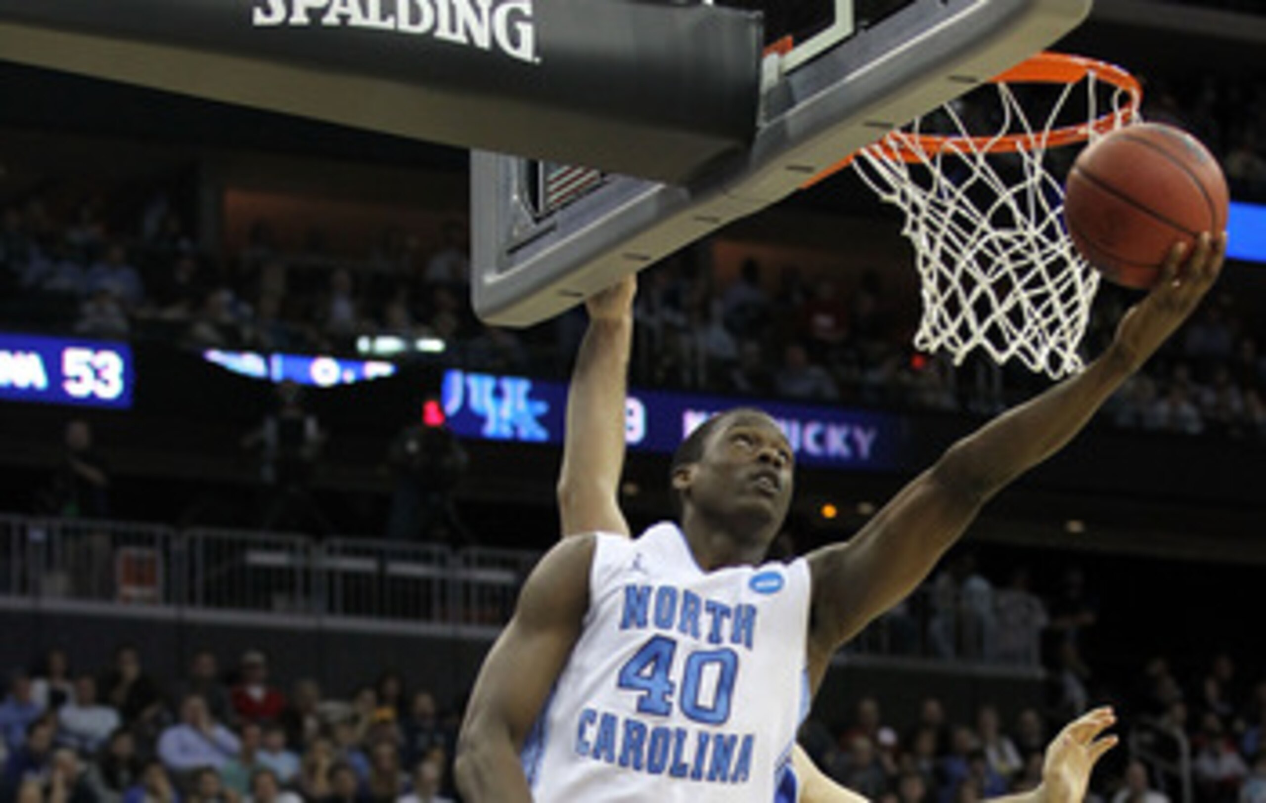 NEWARK, NJ - MARCH 27:  Harrison Barnes #40 of the North Carolina Tar Heels in action against Josh Harrellson #55 of the Kentucky Wildcats during the east regional final of the 2011 NCAA men's basketball tournament at Prudential Center on March 27, 2011 i